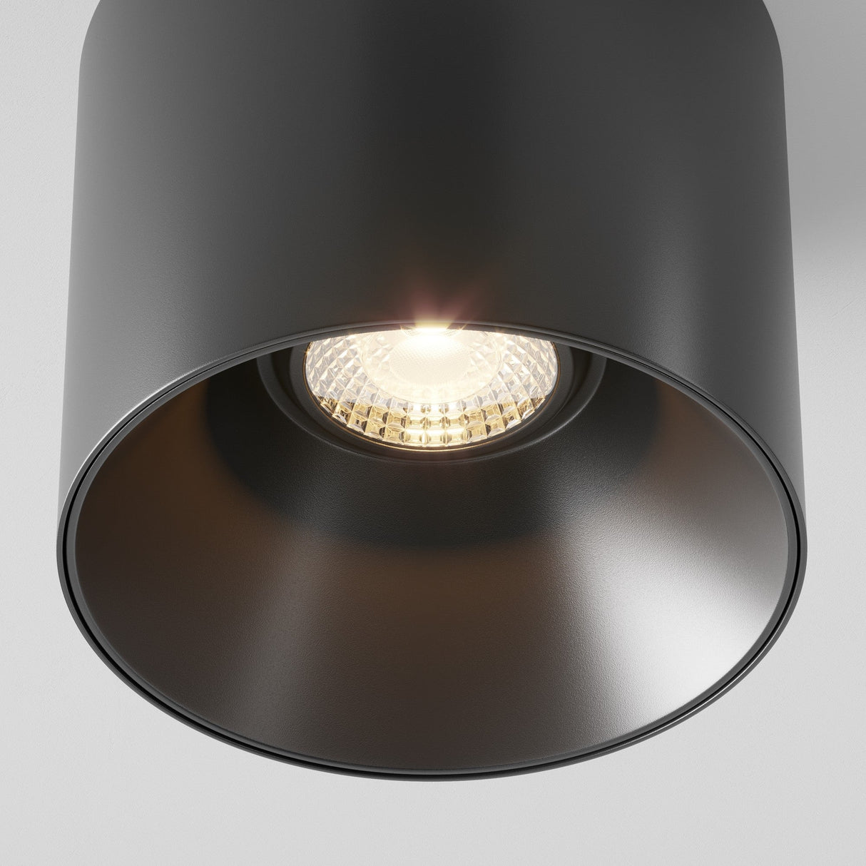 Detailed shot of Alfa LED Dimmable Fixed Round Surface Downlight in black, showcasing its modern design and matte finish
