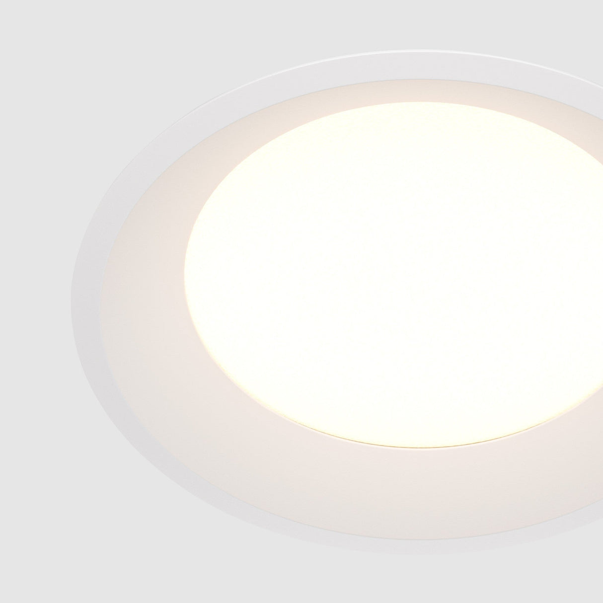 Element detail of Okno LED Round Recessed Downlight in White, highlighting its smooth surface for unobtrusive lighting.