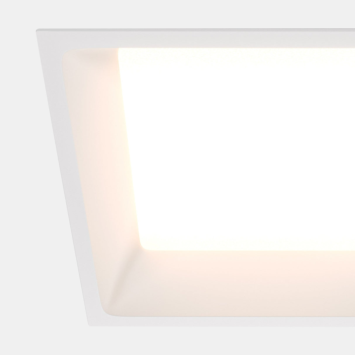 Close-up of the Okno LED Square Recessed Downlight in white, emphasizing its smooth finish and modern aesthetic