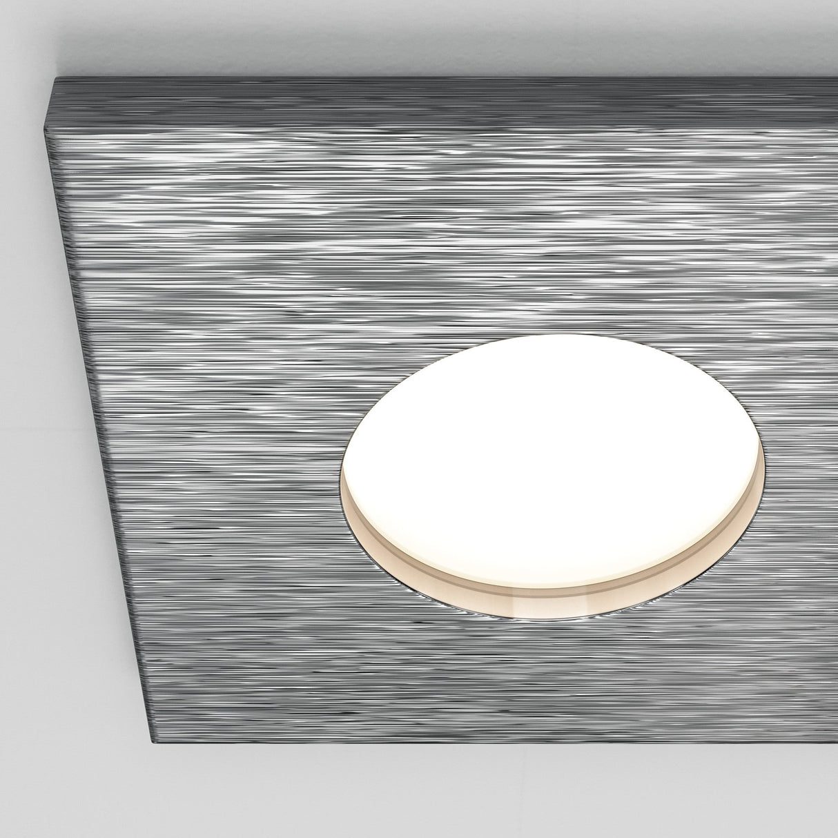 Close-up of Stark fixed square recessed downlight in silver, showcasing its clean and minimalistic design.