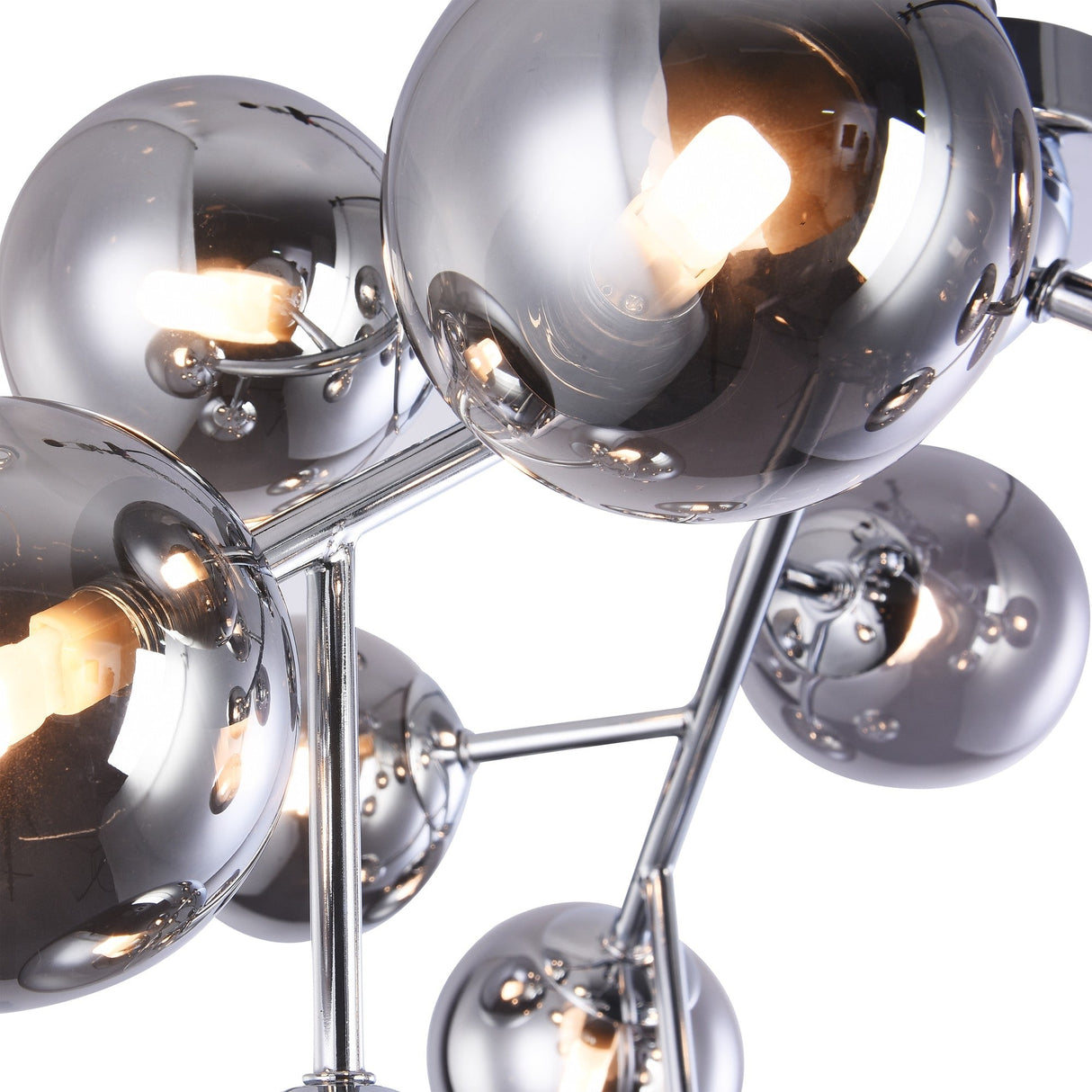 The Dallas 12 Light Semi-Flush - Chrome With Smoky Glass showcases a sleek, modern design with reflective chrome spheres connected by silver rods. The smoky glass spheres encase visible bulbs, casting warm light and mirroring effects on surfaces.