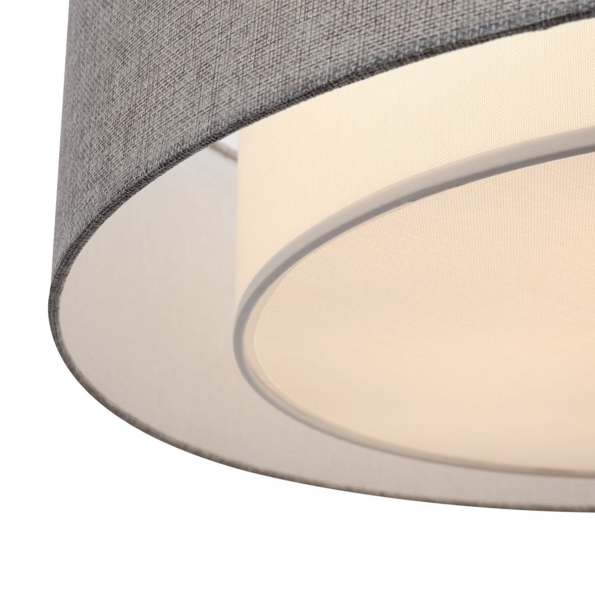 The Bergamo 3 Light Flush - Chrome features a cylindrical shape with a grey fabric outer lampshade and a white inner diffuser, creating soft, even light distribution. Its contemporary design adds subtle elegance to any room.