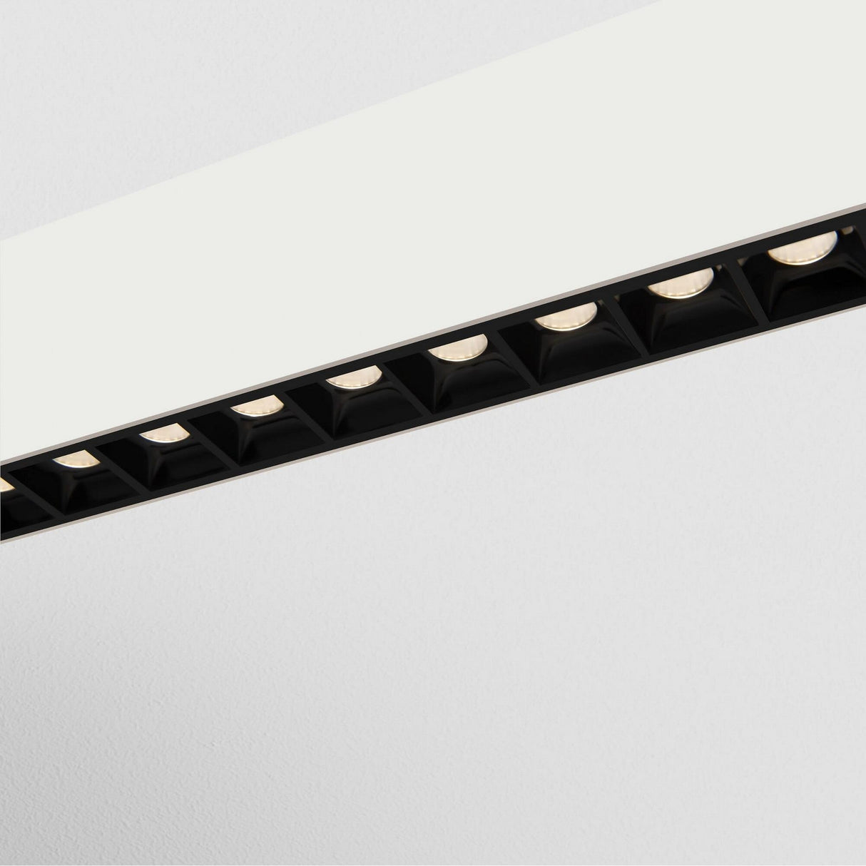Detail of Points LED Linear suspension light in White, highlighting its suspended structure for elegant ambient lighting.