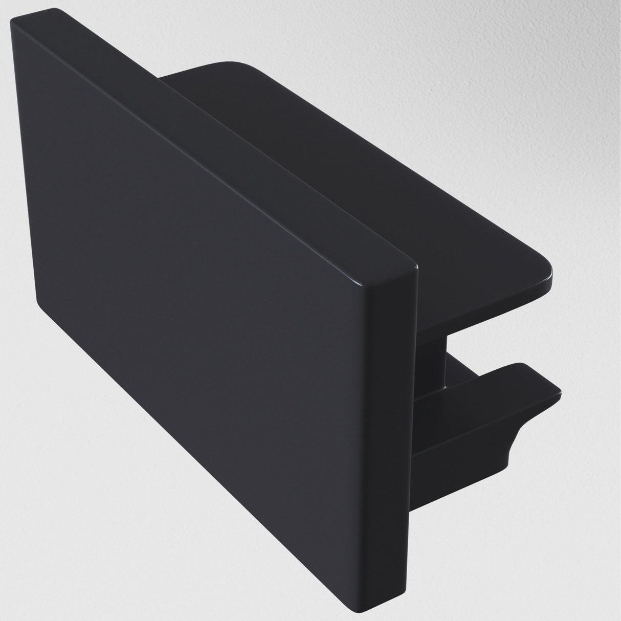 The Unity Single Phase Surface-Mounted Track End Cap in black, featuring a minimalist, rectangular design with smooth, sharp edges and a hollow interior, is displayed on a plain white background.