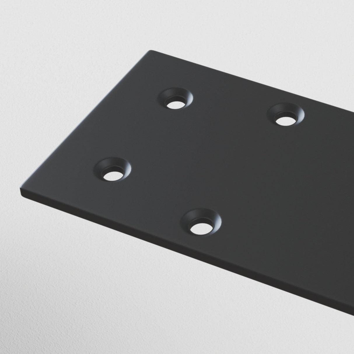The S35 Magnetic Surface-Mounted Track End Cap in black, crafted from durable aluminum, features four circular holes in a square pattern. Its sleek surface stands out against the plain white background.