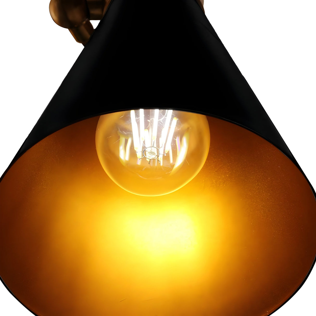 Close-up of the Ramses 5 Light Chandelier in Black, featuring a glowing bulb within its black and gold shade and industrial design, as warm yellow ambient light illuminates the space.