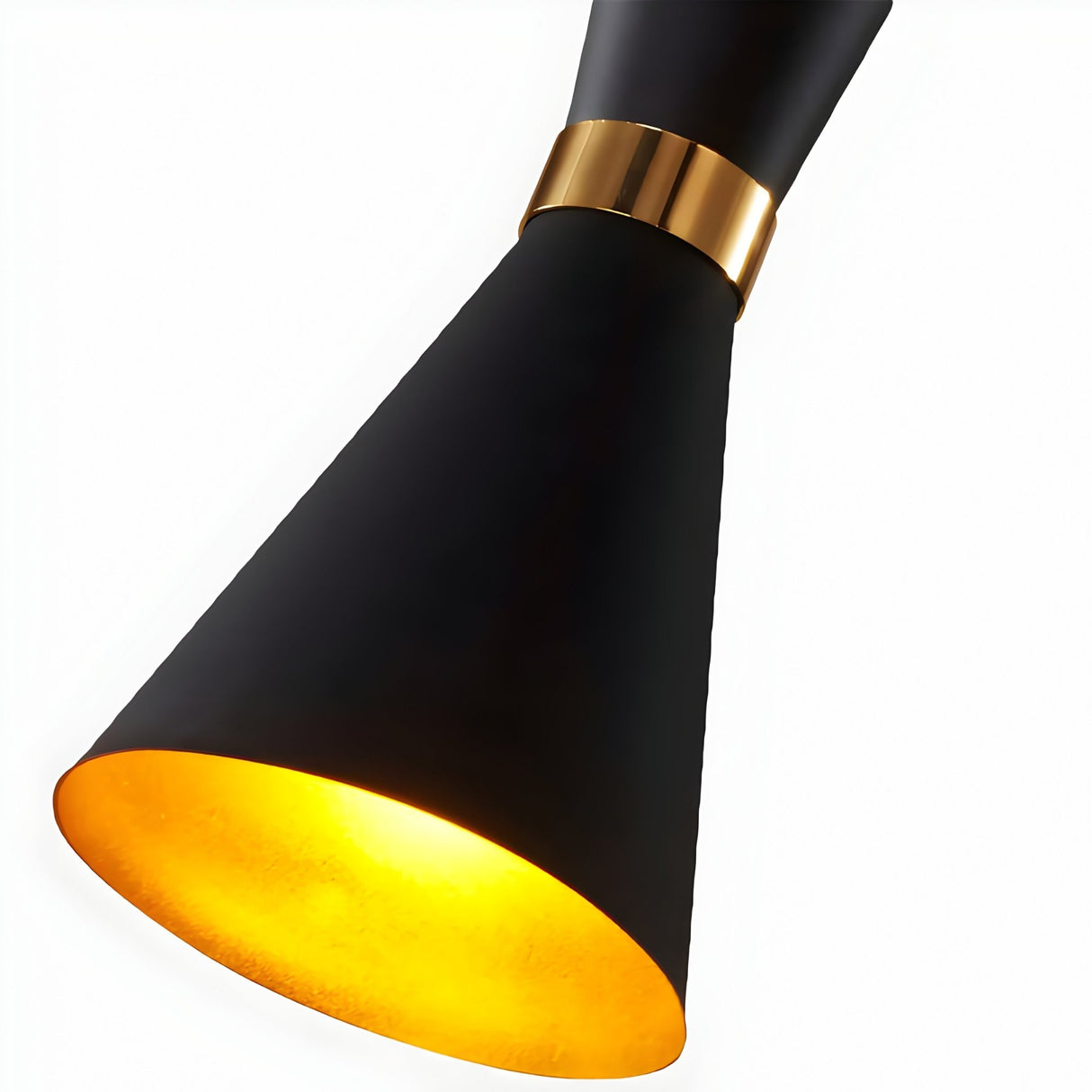 The Ramses Pendant Light - Black features a modern black design with a gold accent ring and a cone-shaped shade, casting a warm yellow glow that evokes the sleek style of black metal pendant lighting for elegant, contemporary spaces.