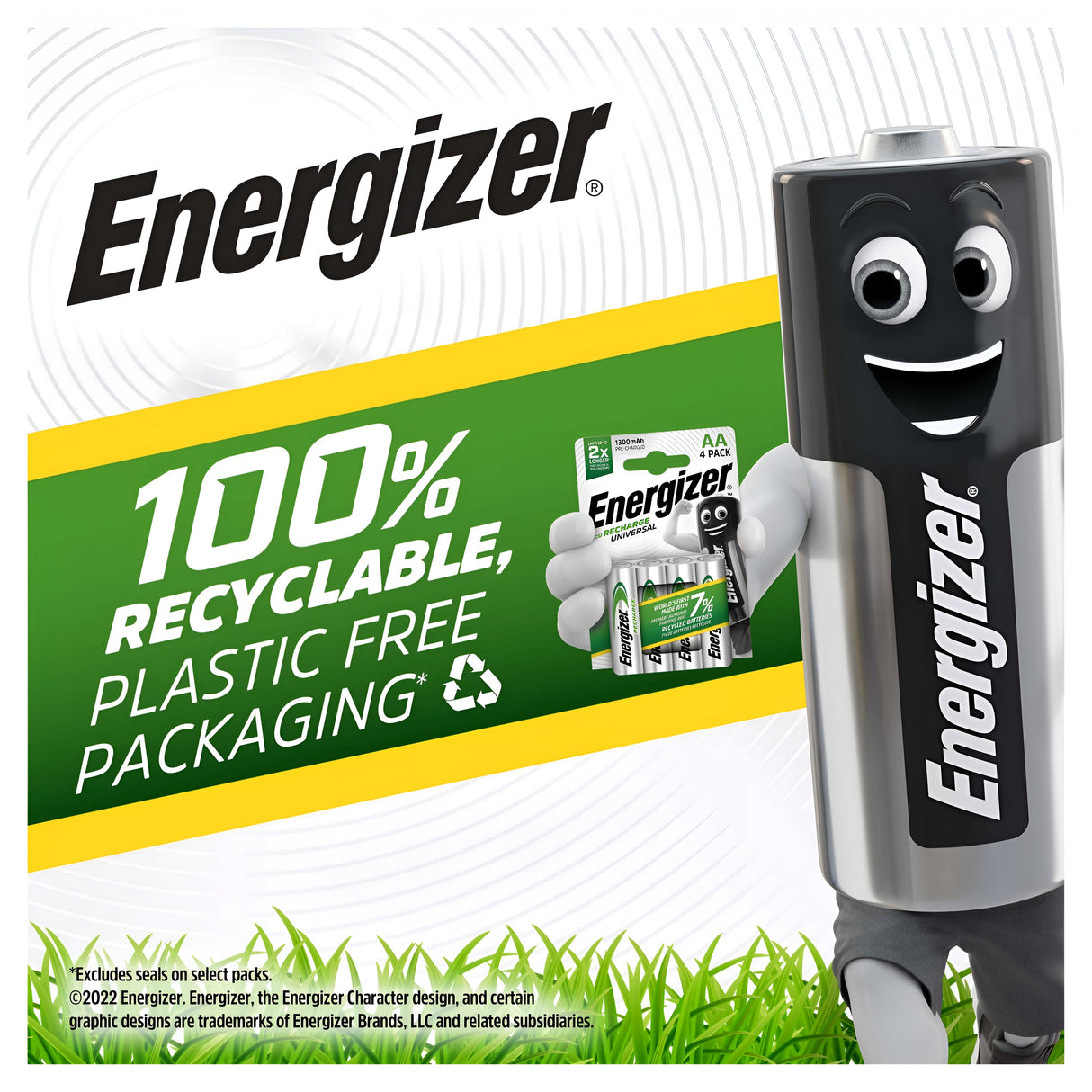 An Energizer Universal AAA HR03 Rechargeable Battery, featuring a smiling cartoon face, stands beside a package of AAA batteries, emphasizing their role as a sustainable power solution. Text reads 100% Recyclable, Plastic Free Packaging. Vibrant green grass and a recycle symbol adorn the bottom.