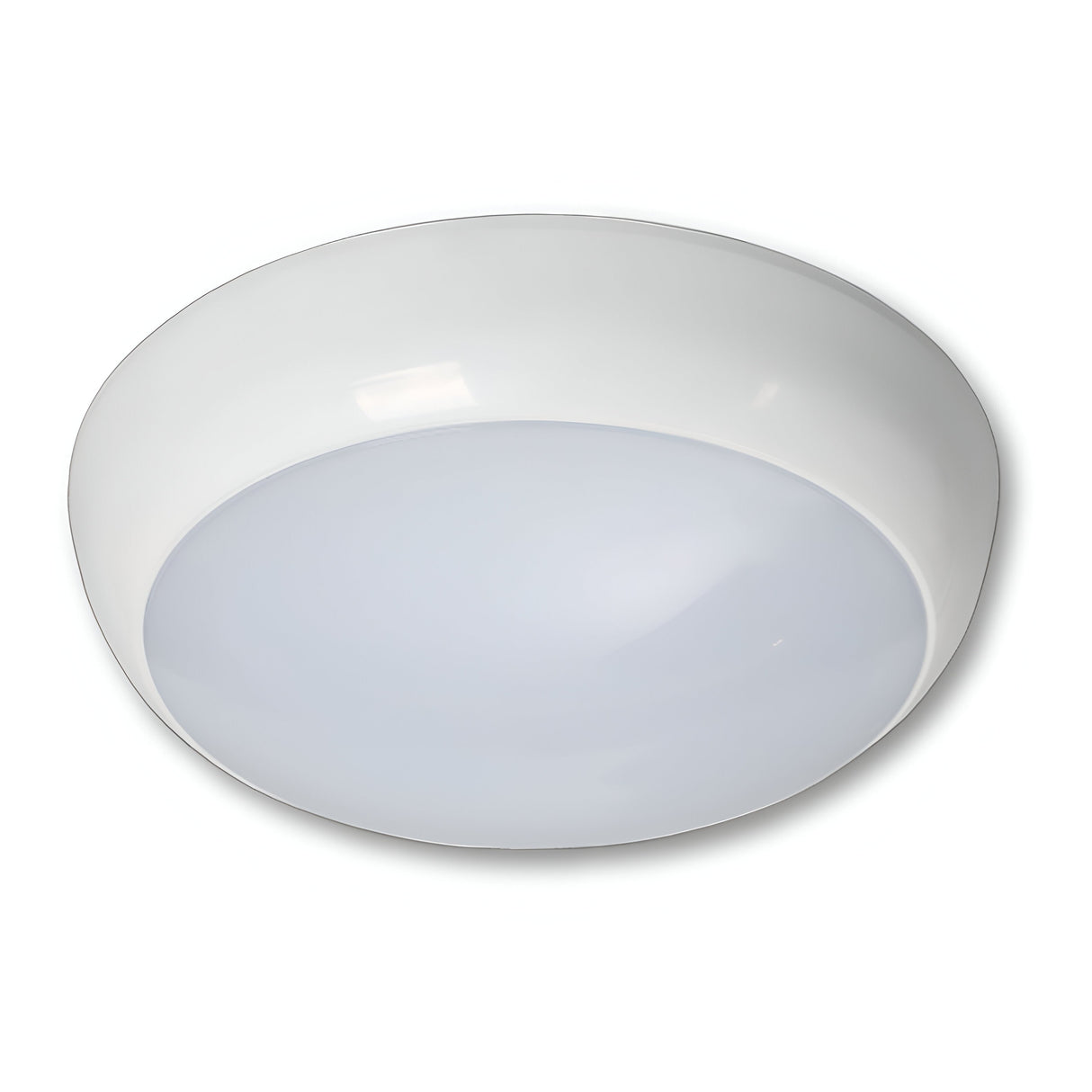 The PowerMaster Outdoor Bulkhead Body - White is a round ceiling light with a minimalist design, featuring a domed polycarbonate diffuser for even light distribution. It has an ABS base for durability and integrates well with modern interiors while maintaining an IP65 rating for moisture resistance.