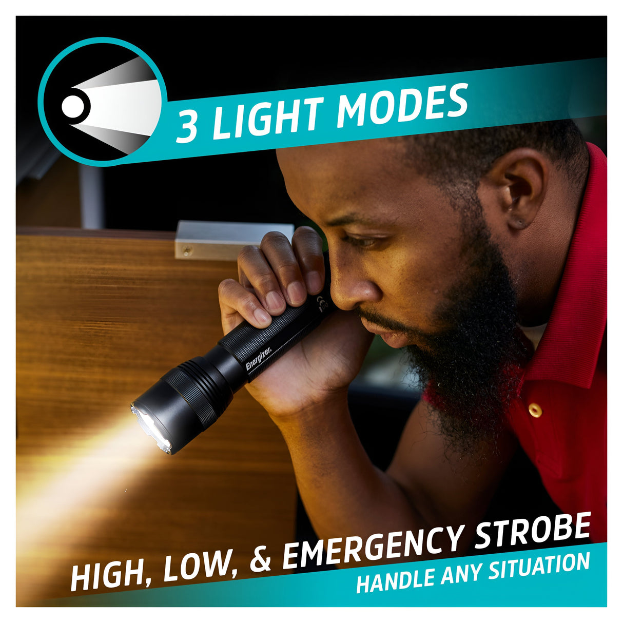 A person using the Energizer Rechargeable LED Torch 1200 Lumen - Batteries Included under a desk, casting light in the area. The image highlights 1200 Lumens with three light modes: high, low, and emergency strobe, along with the text "Handle Any Situation.