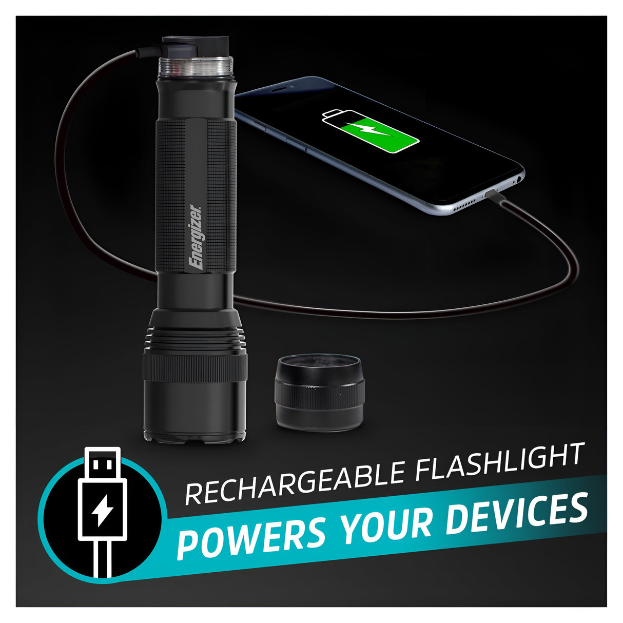 An Energizer Rechargeable LED Torch 1200 Lumen in black sits beside a smartphone charging via a cable. The tactical flashlight features a removable end cap with the text "Rechargeable Flashlight Powers Your Devices." On the phone screen, the battery icon indicates it’s charging.