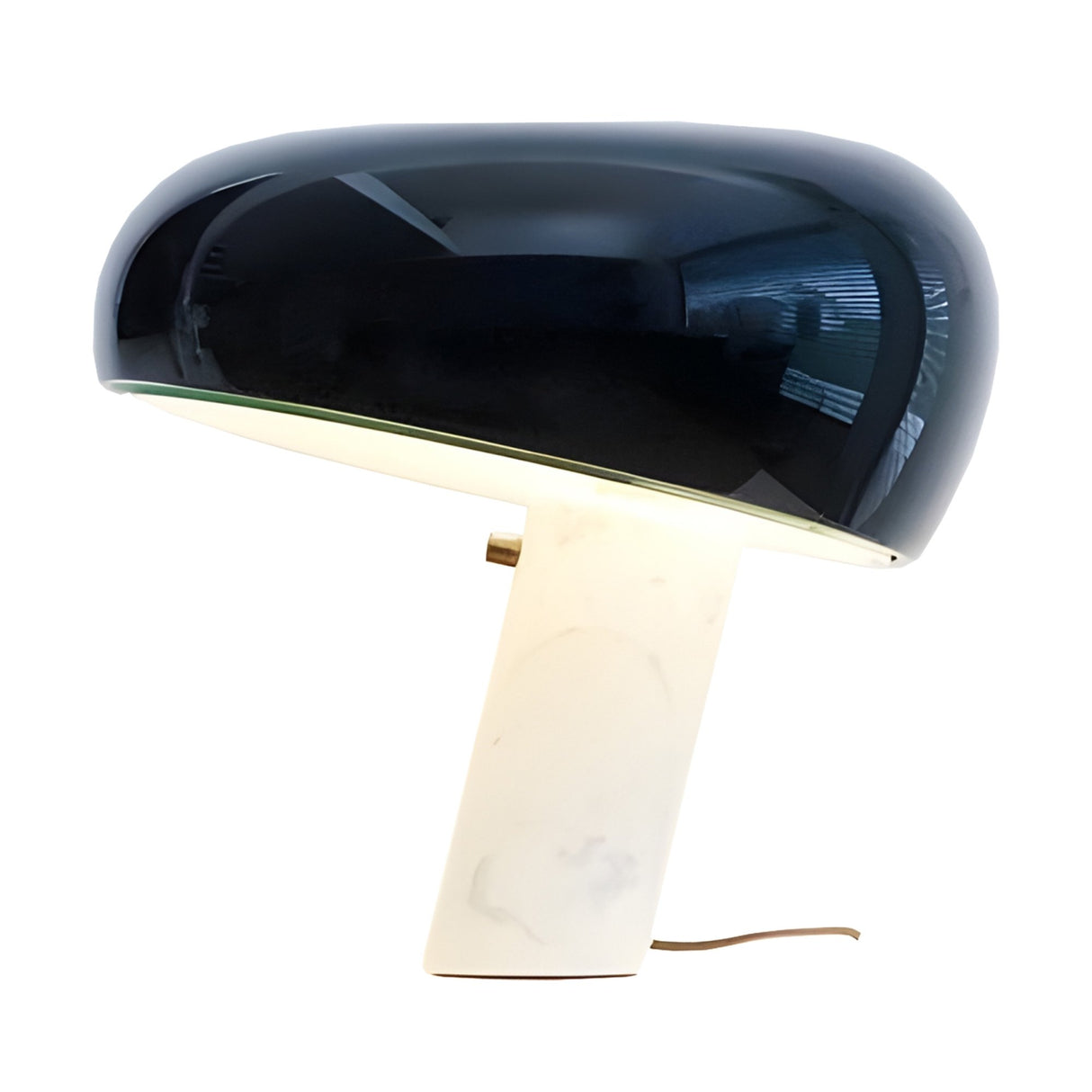 The Sleepy Marble Table Lamp - Black features a large glossy black oval shade and a handcrafted white marble base, angled for modern flair. Photographed on a white background, its power cord accentuates the minimalist design.