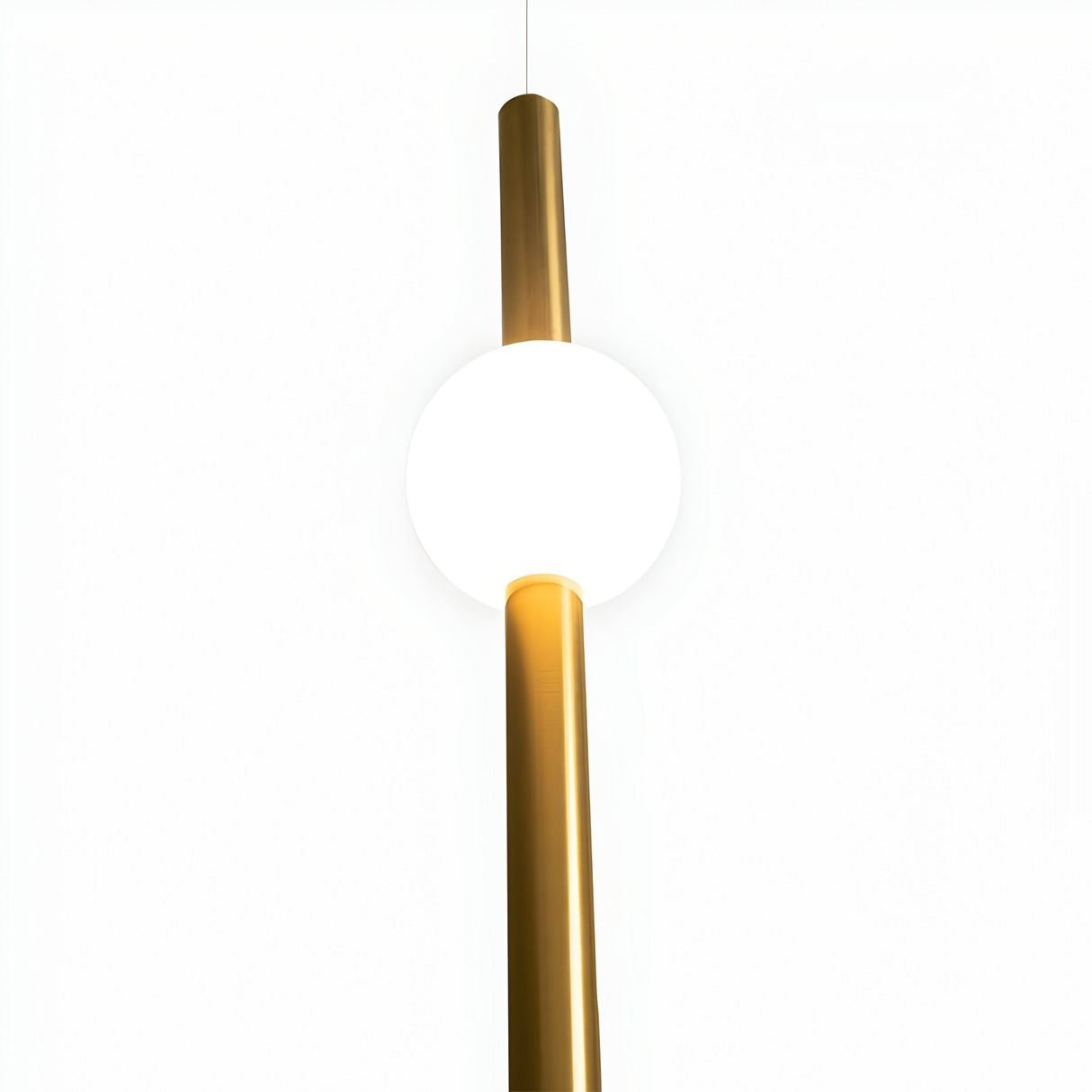 The Sottile LED Vertical Suspension Light - Gold features a minimalist design with a polished gold finish; a vertical rod passes through its glowing white spherical shade, all set against a plain white background.
