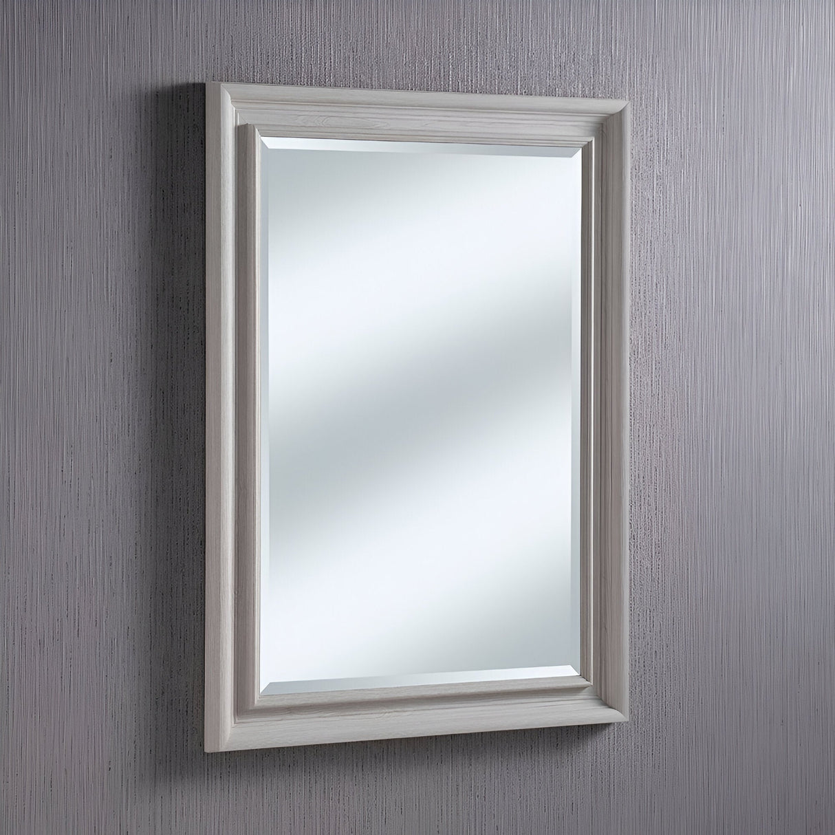 The Spiro Rectangle Wall Mirror - Light Grey hangs elegantly on a light gray textured wall. The wall's subtle vertical pattern adds depth, contrasting with the smooth, reflective surface of this charming piece of home decor.