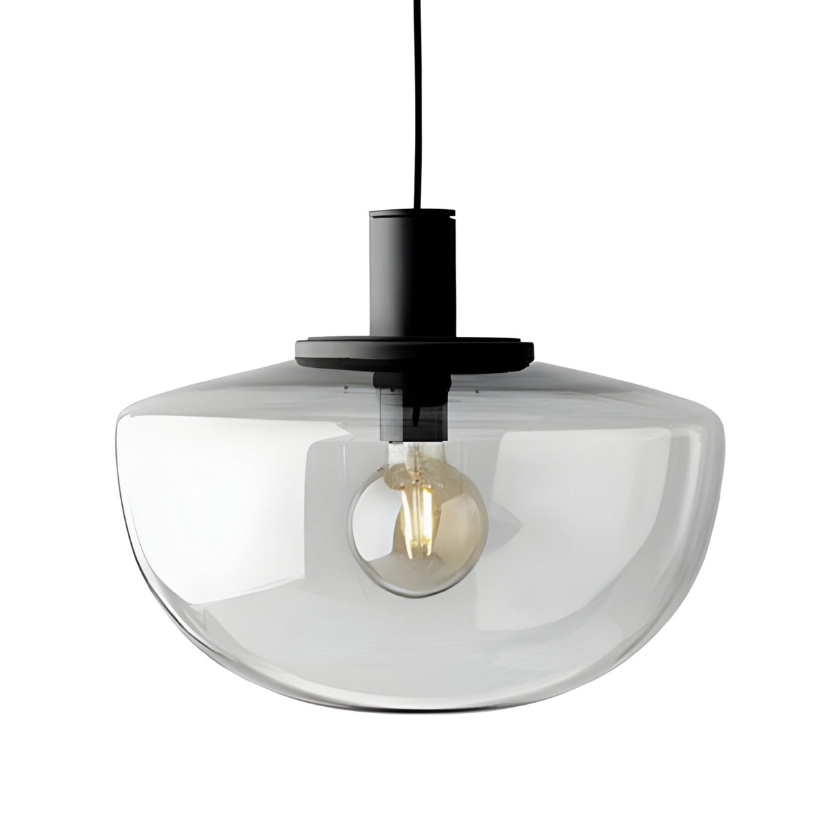 The Verge 1 Light Pendant features a smoked glass dome shade, black fixture, and exposed bulb suspended from a black cord for an ambient glow.