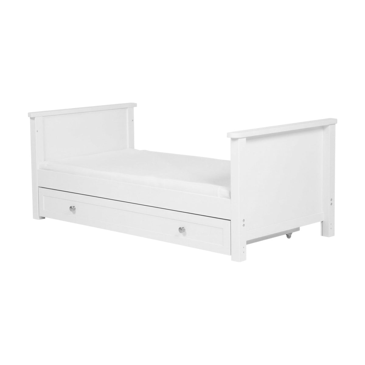 Wanderer Convertible Cot Bed in white MDF, shown as a toddler day bed with panel head and footboards, mattress base, and an under-bed storage drawer with knob handles, on a plain white background.