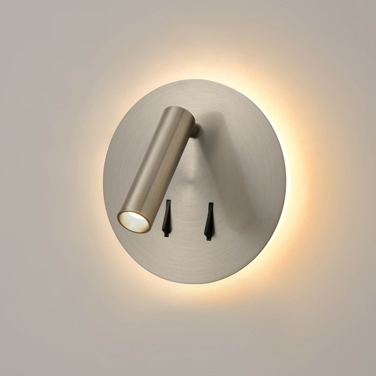 Luca 2 light wall light in satin nickel finish, shown on a dark background