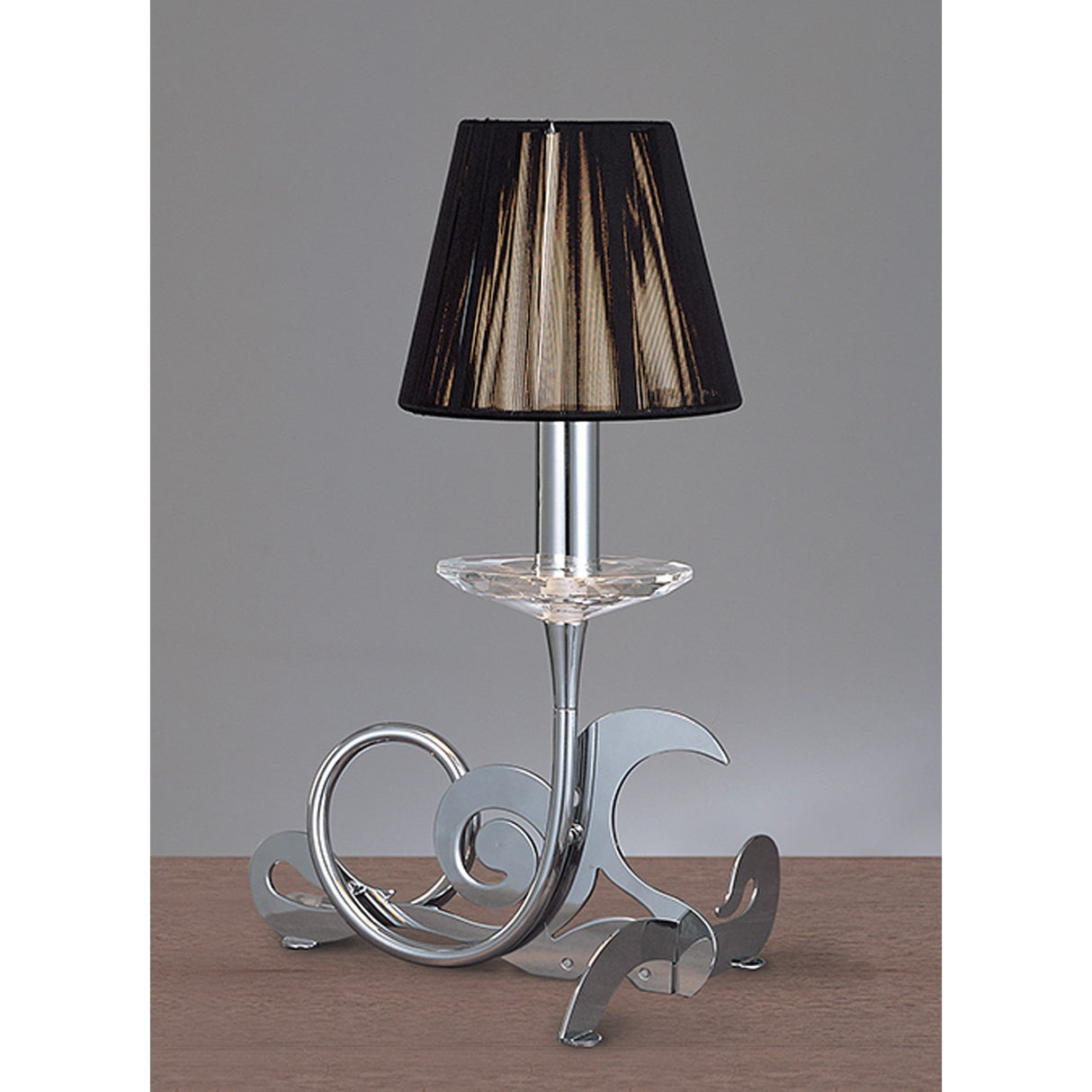 Mantra Acanto 1 light table lamp with polished chrome scrollwork base, cut crystal drip pan, and black pleated silk shade on a neutral background.