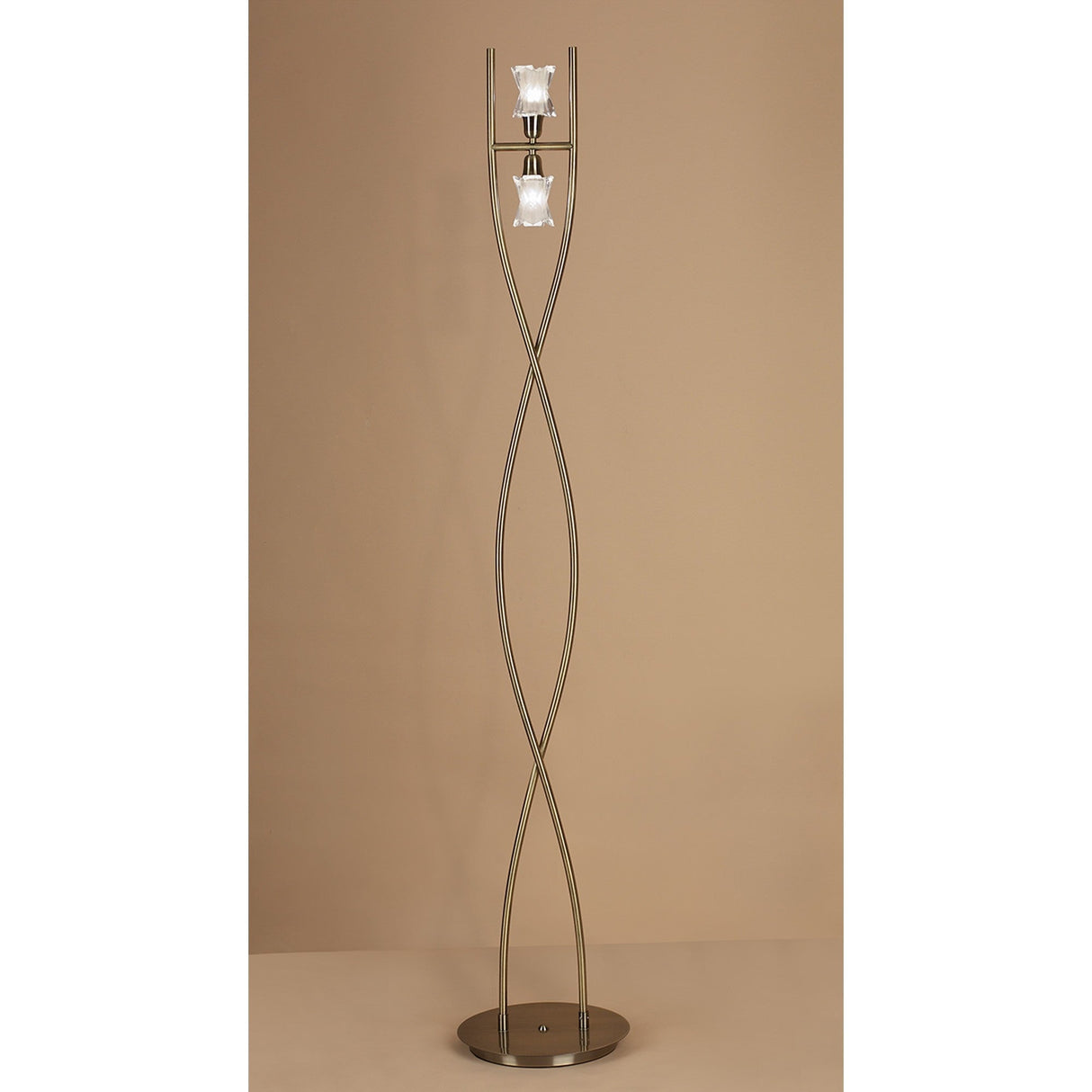 The Alaska 2 Light Floor Lamp in antique brass offers stylish ambient lighting with its tall design and dual lights.