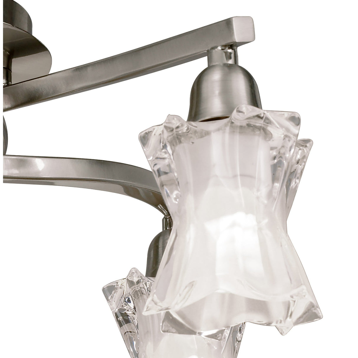 Close-up of Mantra Alaska semi-flush ceiling light showing satin nickel arms and sculpted frosted glass shades with clear faceted star-shaped edges.