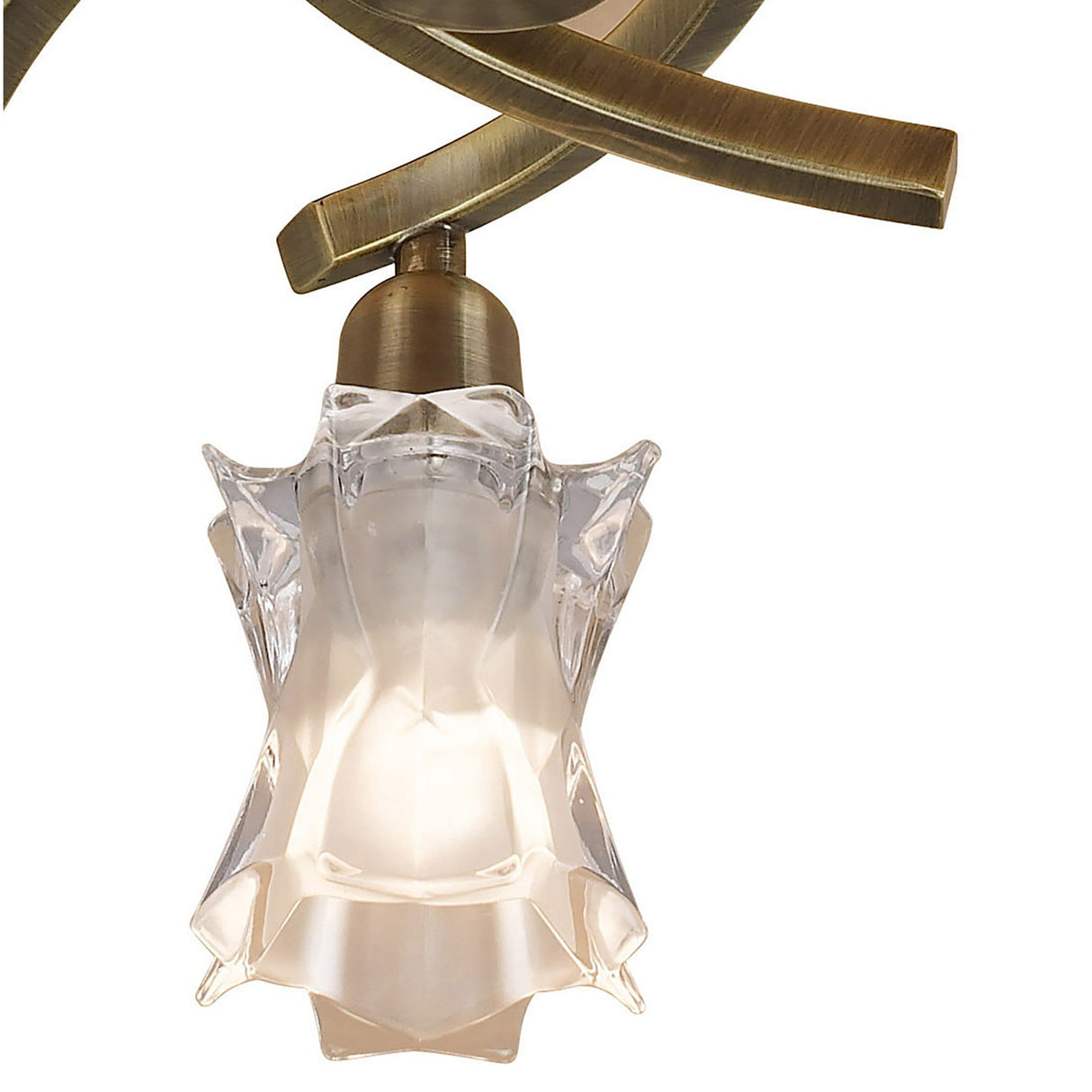 Close-up of the Mantra Alaska semi-flush ceiling light showing a curved antique brass arm and sculpted frosted glass shade with star-like clear facets.