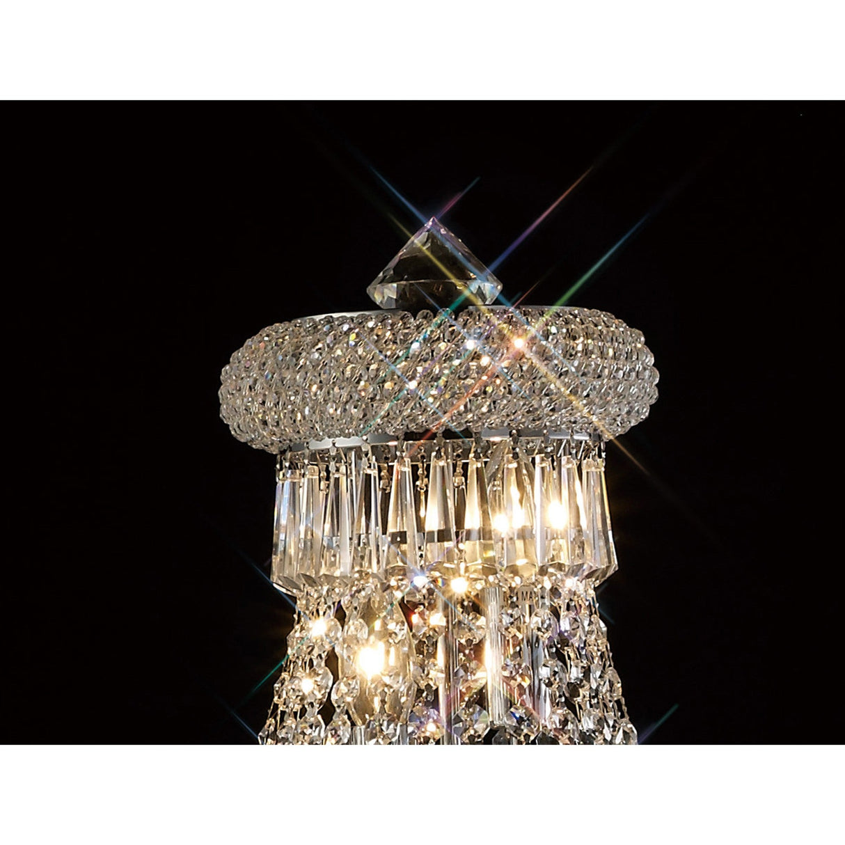 Close-up of the Alexandra 6 Light Crystal Floor Lamp in polished chrome, featuring multifaceted glass prisms and dazzling lights that create starburst reflections—ideal for adding ambient elegance to any space.