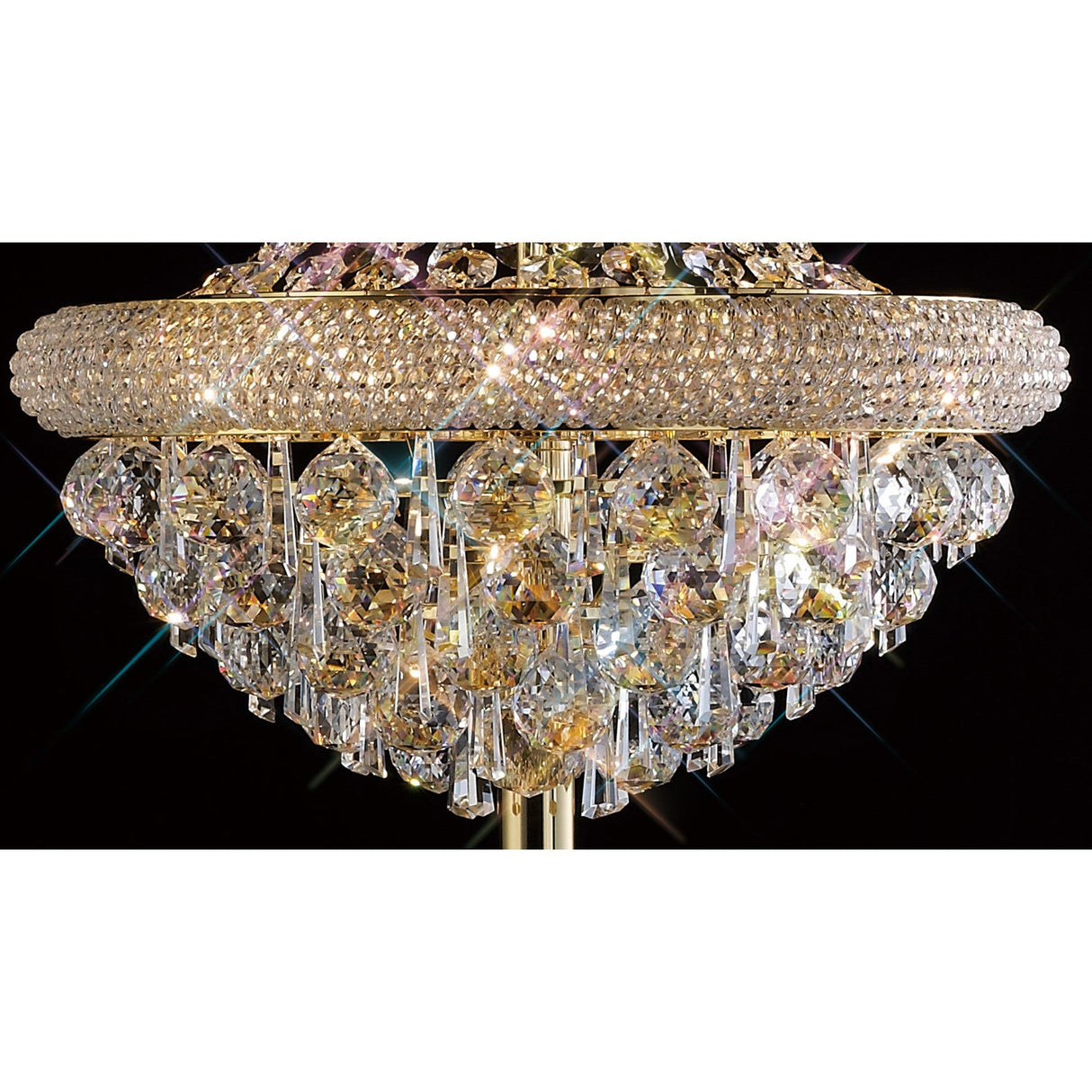 A close-up of the Alexandra 6 Light Crystal Floor Lamp – Gold, showcasing ornate gold accents and sparkling teardrop crystals reflecting light against a black background.