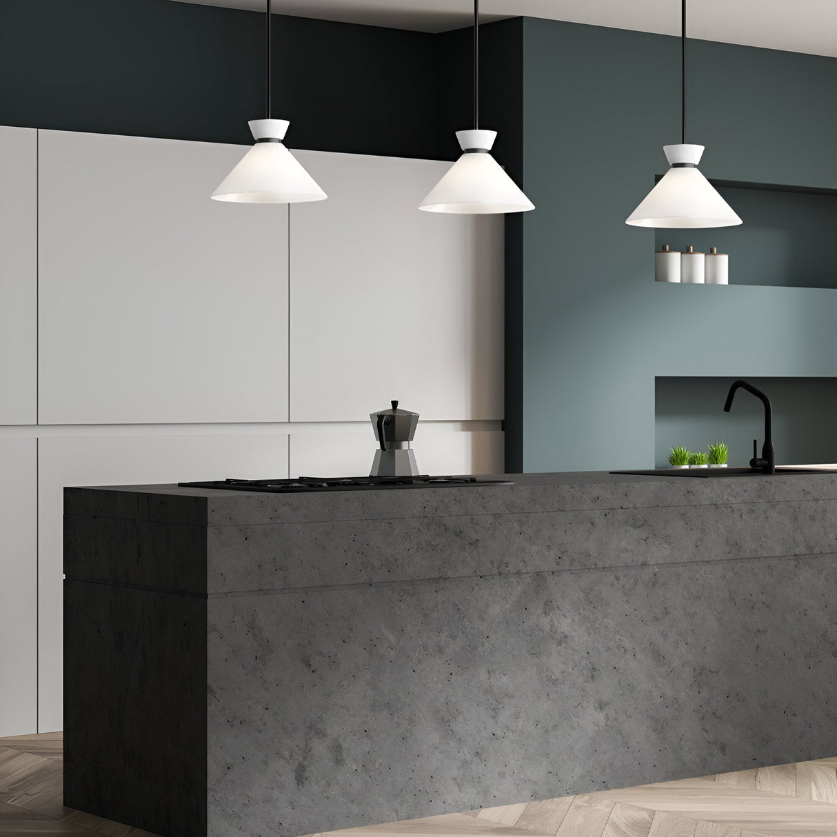 Three Alora Mood Halston conical opal glass pendants with matte black stems hung in a row above a concrete kitchen island in a modern grey kitchen.