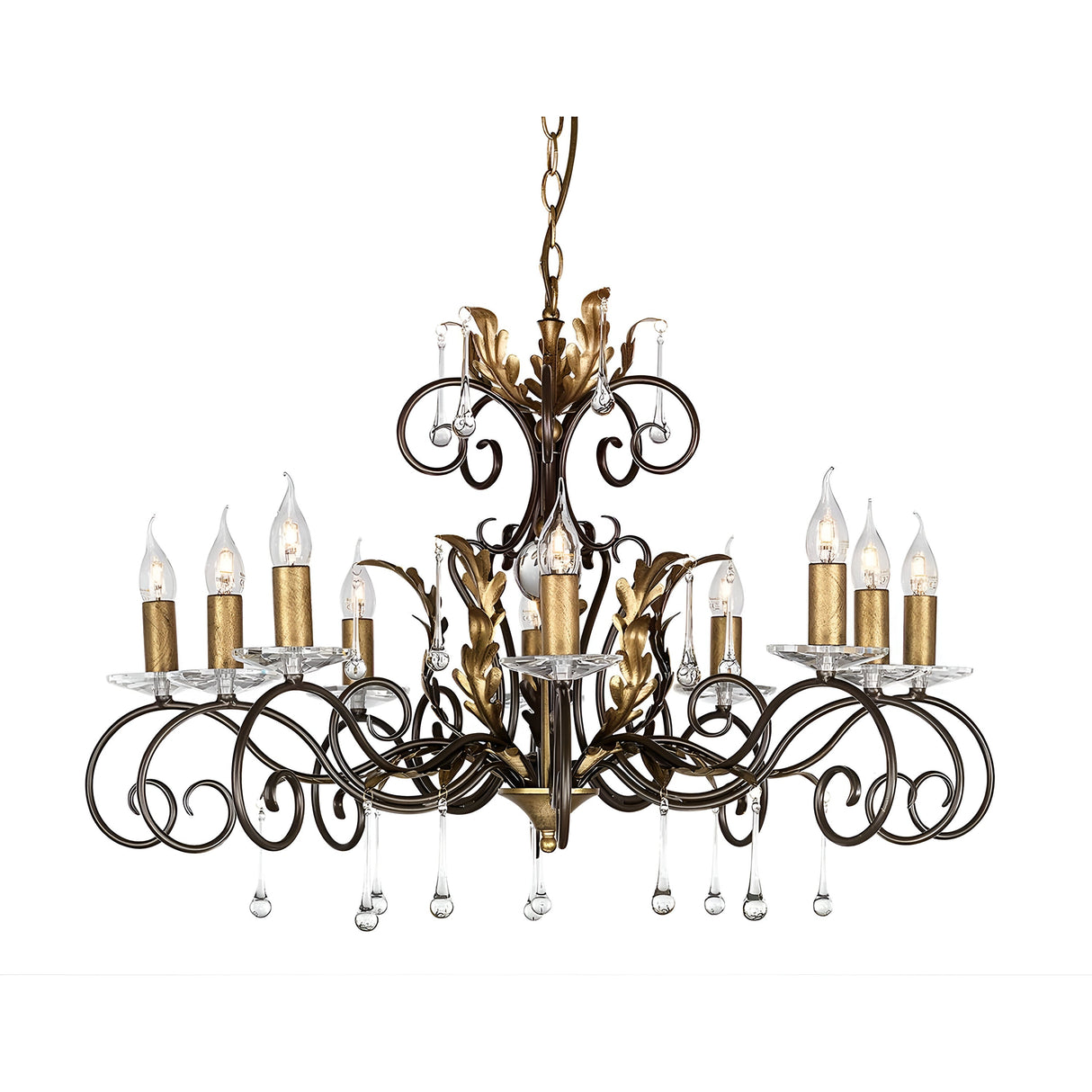 The Amarilli 10 Light Chandelier - Bronze With Gold Patina is a luxurious lighting fixture featuring ten candle-shaped lights. Its intricate bronze scrollwork with gold patina and clear crystal pendants hanging below create an opulent ambiance.