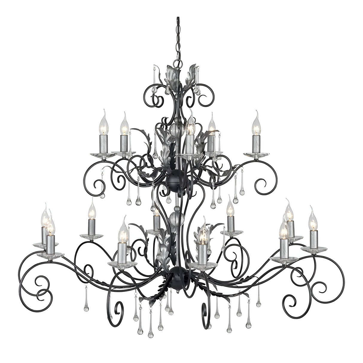 The Amarilli 15 Light Chandelier, finished elegantly in black with silver patina, is a grand wrought iron creation featuring intricate scrollwork. It boasts 15 candle-like bulbs and exquisite hanging crystal accents.