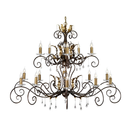 The Amarilli 15 Light Chandelier features a large, ornate design with intricate bronze metalwork accented by a gold patina, multiple candle-style light bulbs, and adorned with hanging crystal decorations.