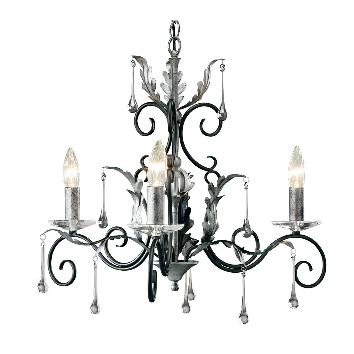 The Amarilli 3 Light Chandelier - Black With Silver Patina, handcrafted by Elstead, features elegant scrollwork and leaf motifs framing candle-shaped bulbs. Its sophisticated design is enhanced by decorative glass droplets set against a white background.