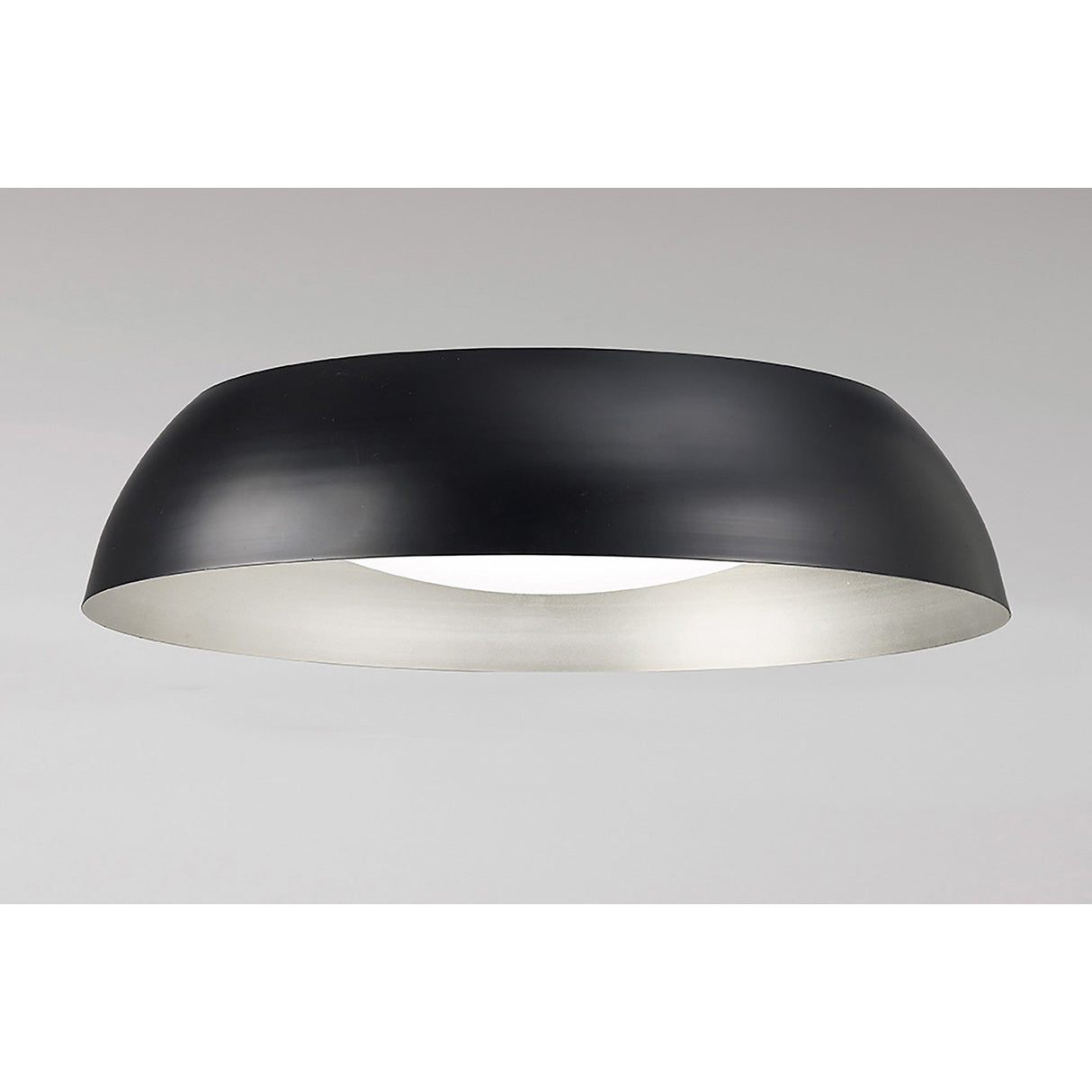 Mantra Argenta LED flush ceiling light with low-profile matt black domed metal shade, silver inner reflector and recessed white diffuser on grey background.
