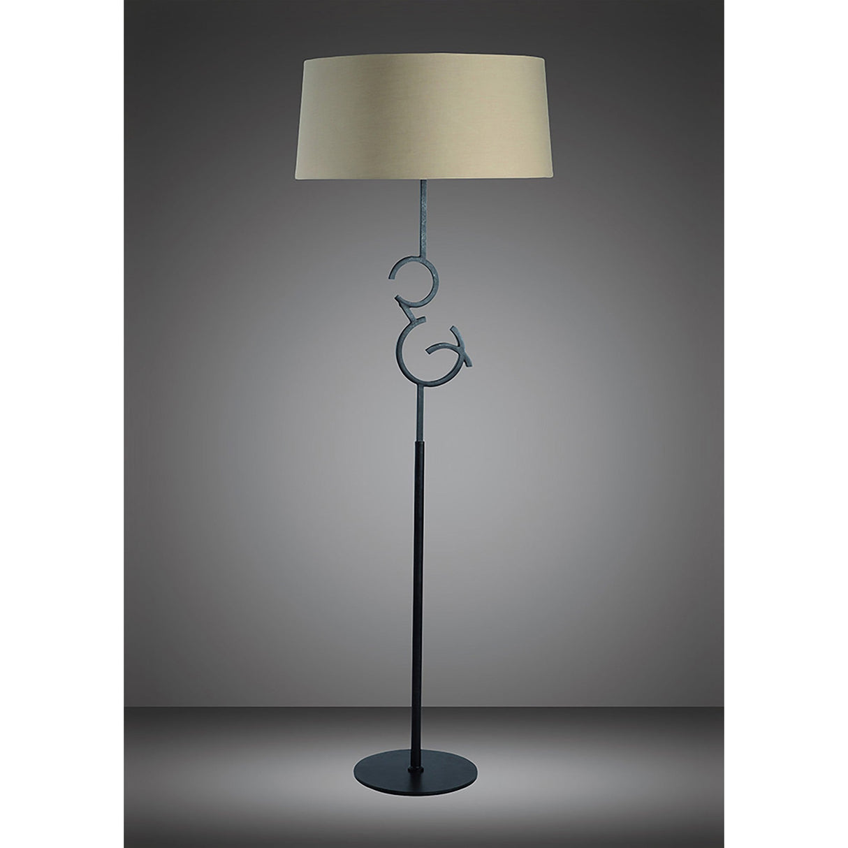 The Argi 3 Light Floor Lamp features a transitional style with a brown oxide stand, taupe drum shade, and decorative metal birds on circular loops beneath the shade—an elegant accent for any neutral space.
