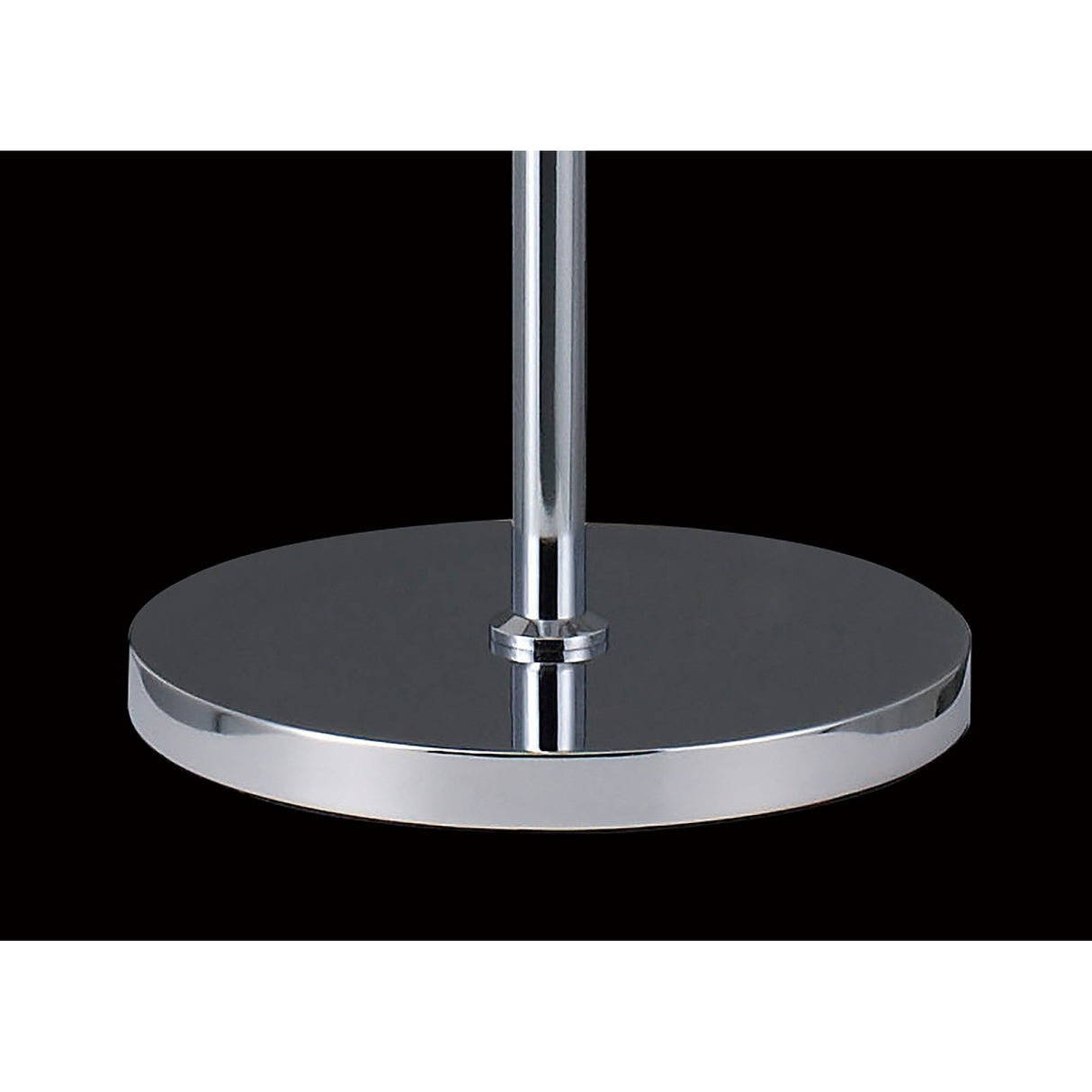 A polished chrome base with a vertical pole exemplifies the sleek elegance of the Atla 4 Light Crystal Floor Lamp, set against a solid black background.