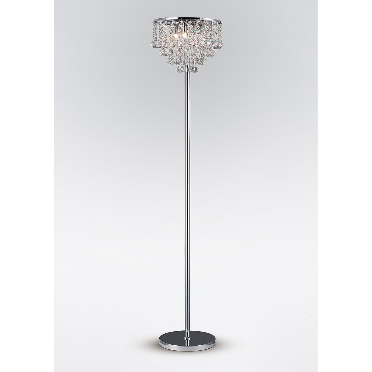 The Atla 4 Light Crystal Floor Lamp features a slim polished chrome stand, a round base, and a chandelier-style shade, shown against a plain white background.