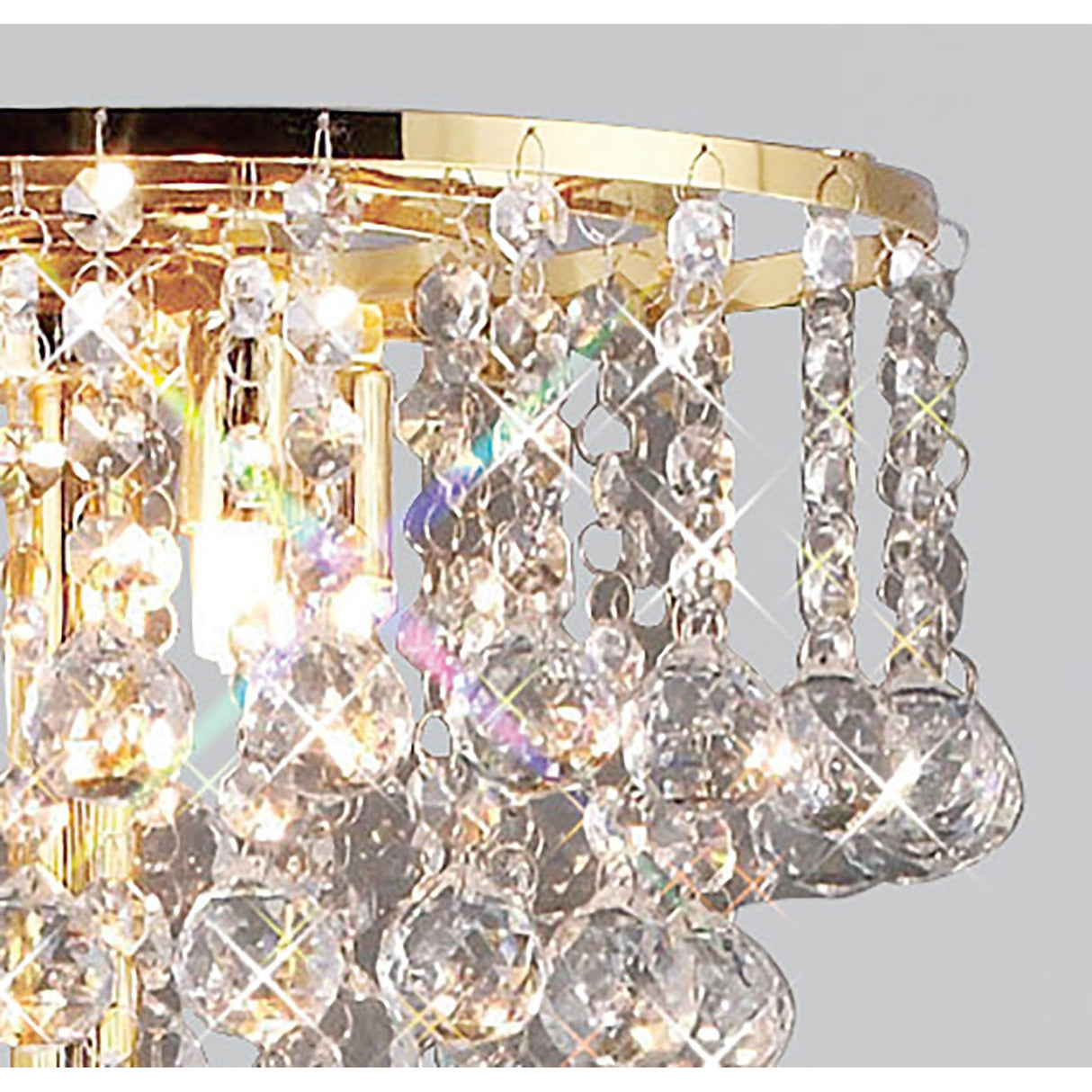 Close-up of the Atla 4 Light Crystal Floor Lamp in French Gold, featuring hanging crystal prisms and beads that reflect light to create sparkling rainbow patterns.