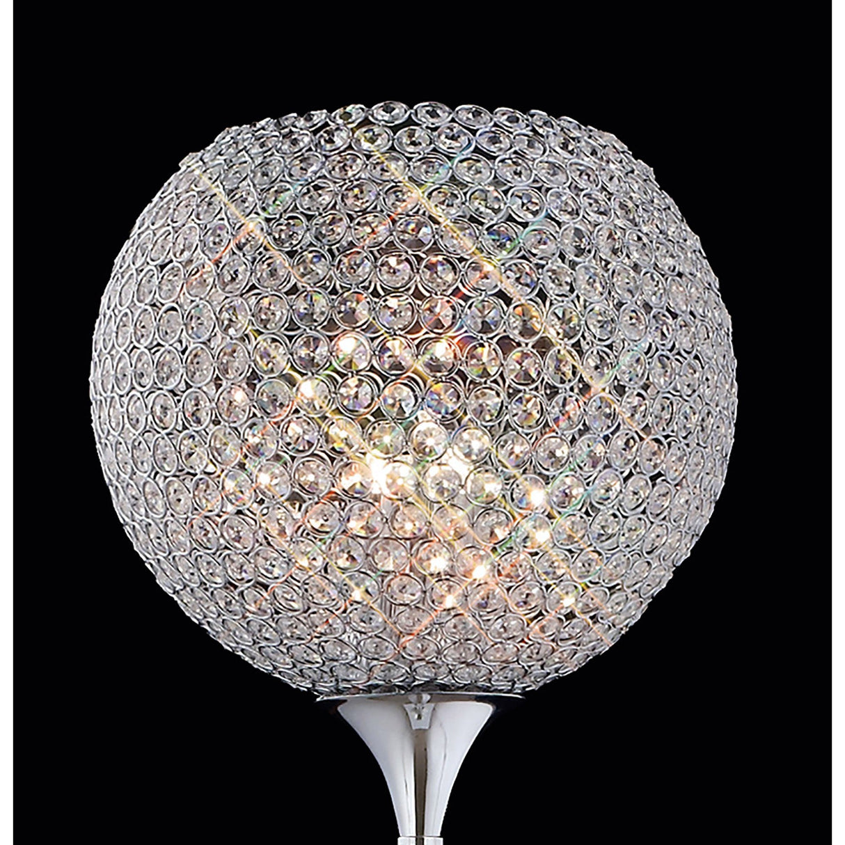 A close-up of the Ava 5 Light Crystal Floor Lamp in polished chrome shows its circular crystal lampshade with light shining through, creating sparkling reflections. This contemporary lamp stands out against a black background.