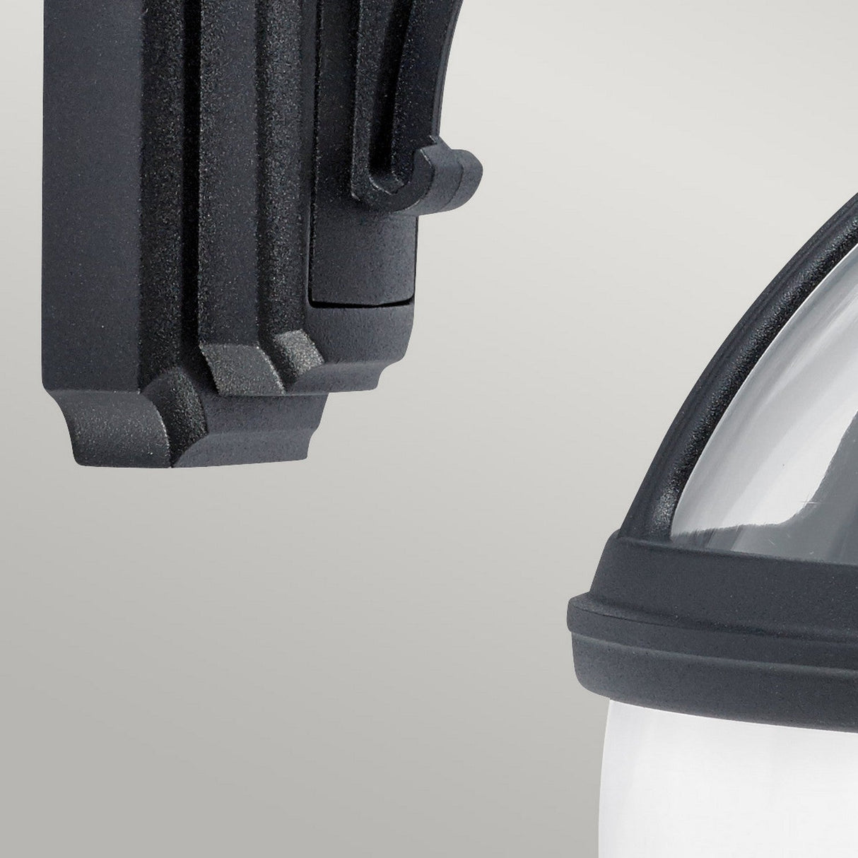 Close-up of the Bologna Outdoor 1 Light Down Wall Light in black, featuring a sleek glass cover and an IP54 rating. The image emphasizes the fixture's modern finish, clean lines, and robust construction against a neutral background, making it ideal for any setting.