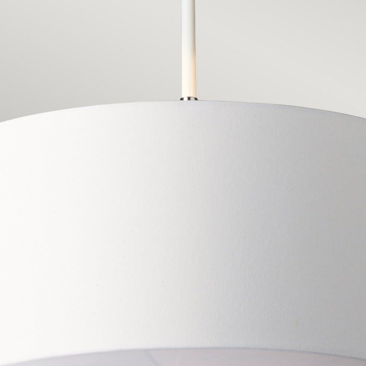 Close-up view of the Balance Pendant Light - White/Polished Nickel, featuring a cylindrical fabric lampshade suspended from a sleek metal rod against a light gray background, providing modern lighting with energy-efficient illumination.