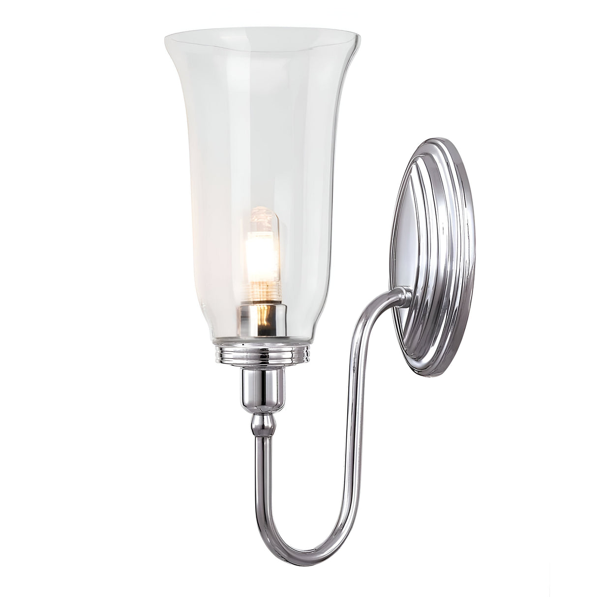 The Blake Wall Light - Polished Chrome is a wall-mounted fixture boasting a sleek, curved metal arm and a clear glass shade. Its polished chrome finish, combined with the visible LED G9 lamp inside, creates a warm glow that enhances any space.