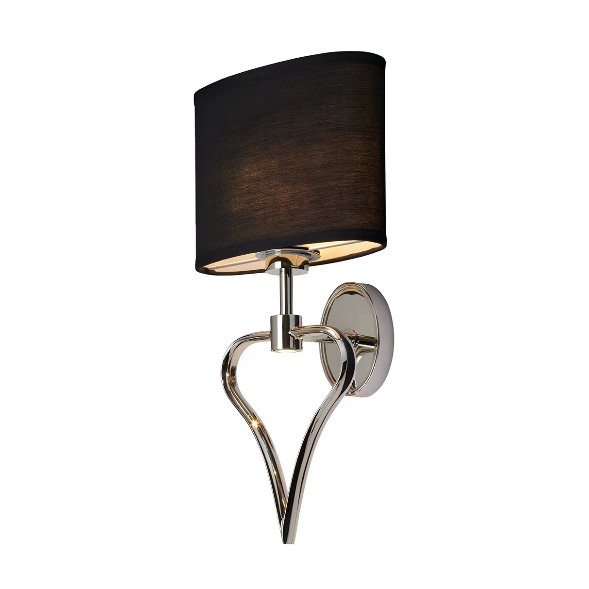 The Falmouth Wall Light - Polished Chrome/Black Shade is a contemporary wall sconce with a polished chrome base elegantly shaped like a heart. It comes with a cylindrical black shade, offering a sleek and modern appearance. The fixture is attached to a circular wall plate, making it an ideal choice for adding sophistication to any room.