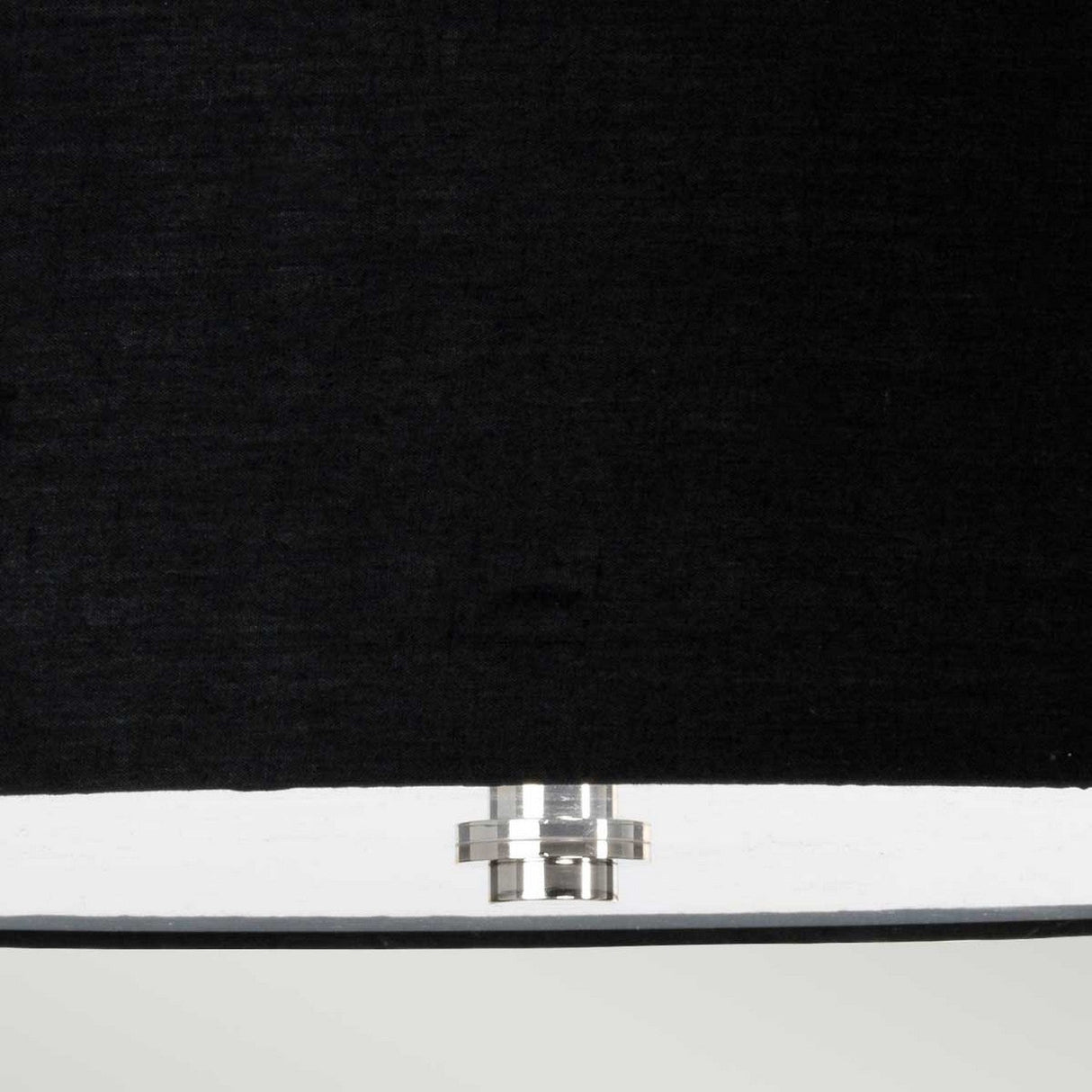 Close-up of the Falmouth 3 Light Semi Flush, featuring a black shade and polished chrome connector gleaming at the bottom edge against a neutral background, highlighting the elegance of integrated LED technology.