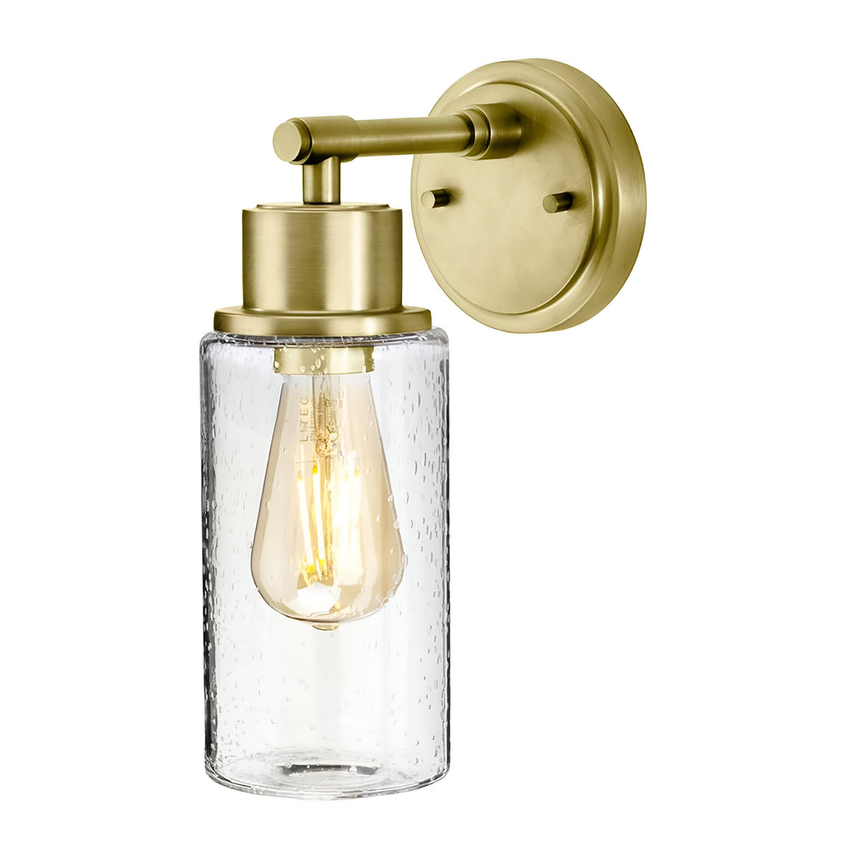 The Morvah 1 Light Outdoor Wall Light in brushed brass features a clear, textured glass shade housing an exposed filament bulb. This vintage-inspired design elegantly blends sleek metal and glass elements for a modern yet classic appearance.