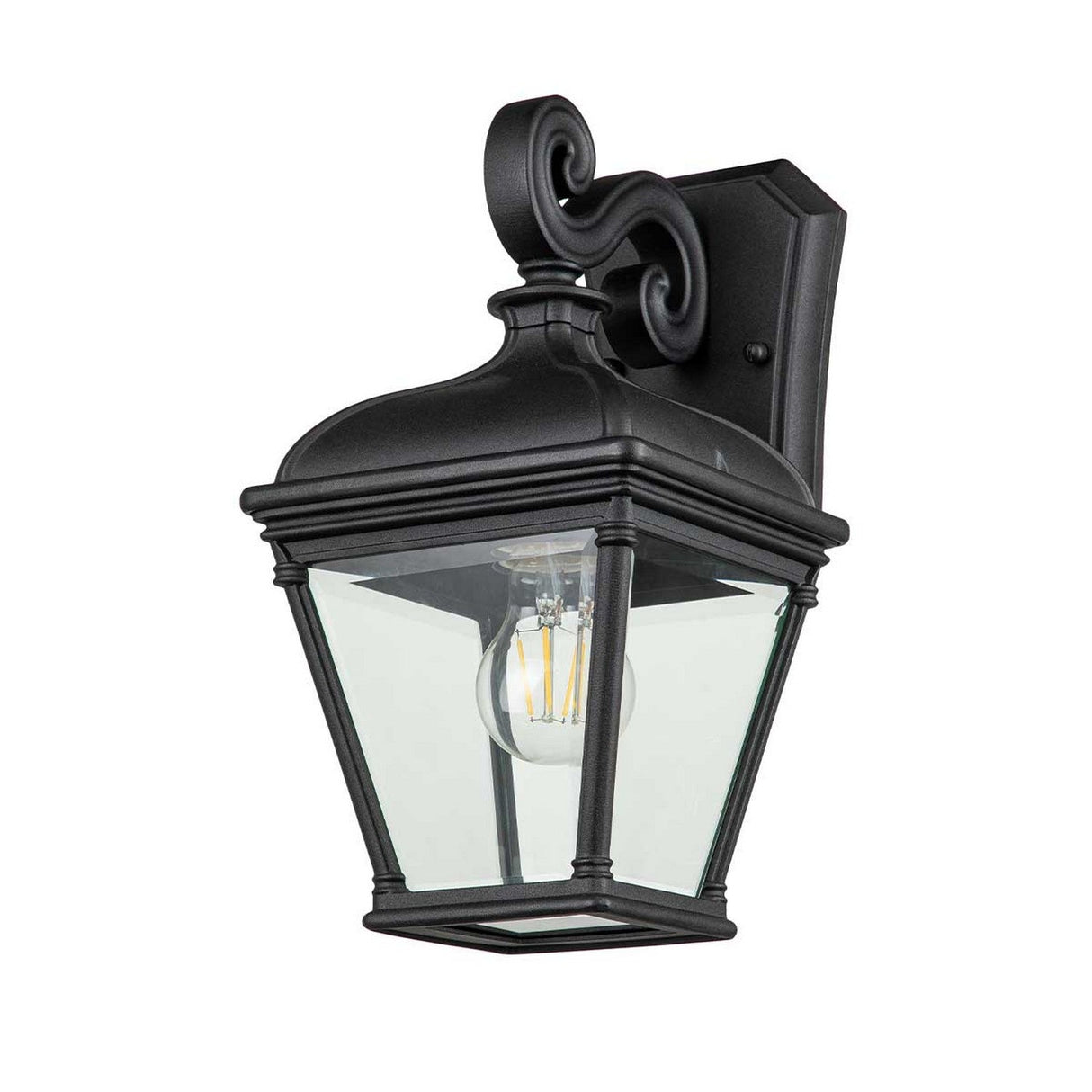 The Bayview 1 Light Outdoor Medium Wall Lantern in black is a decorative outdoor fixture featuring an elegant scroll design. It showcases clear glass panels that reveal a filament bulb, and this classic lantern is mounted on a rectangular base to offer timeless outdoor lighting with its vintage charm.