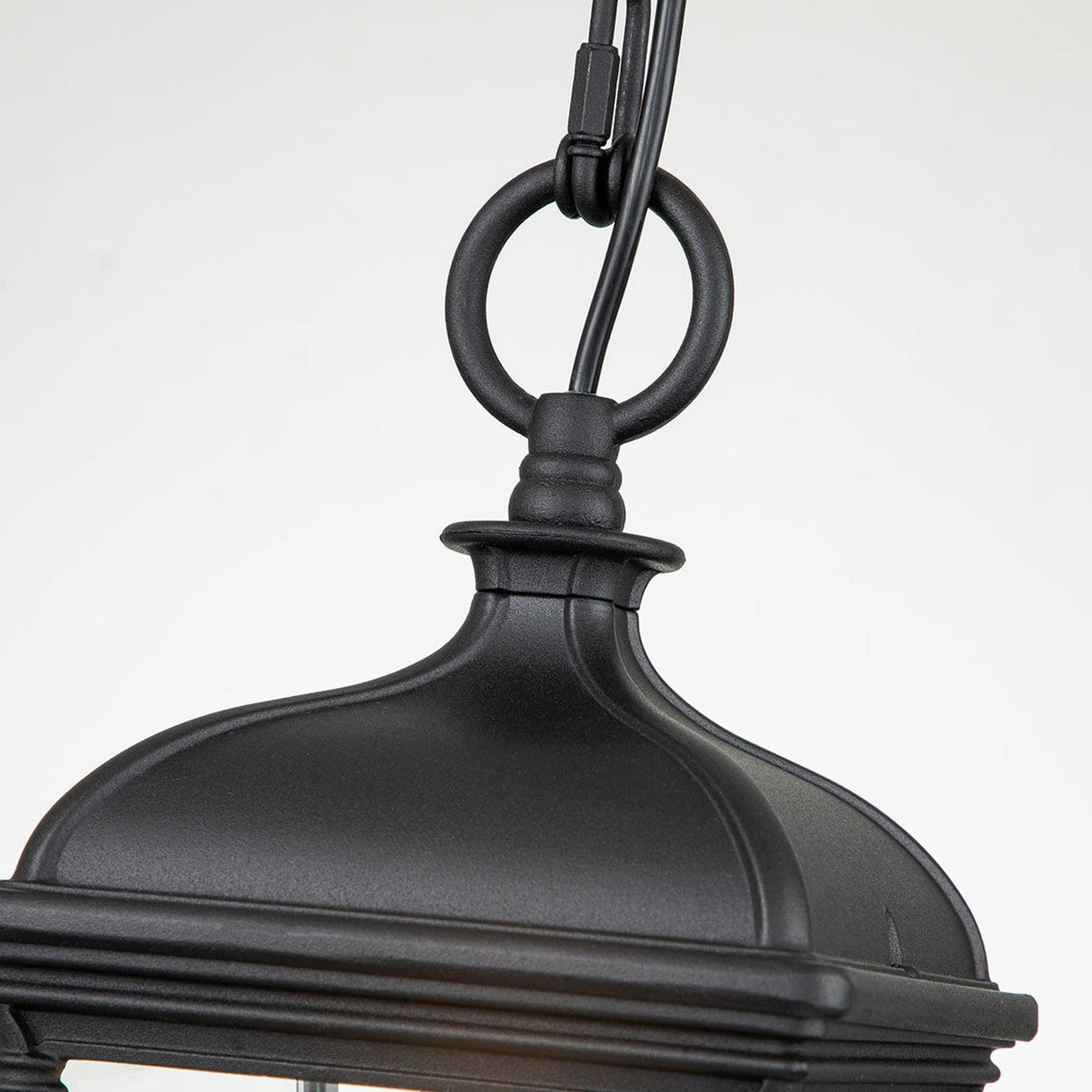 A detailed view of the Bayview 1 Light Outdoor Medium Chain Pendant in black, showcasing Georgian elegance with a decorative ring at the top. This timeless design has a smooth finish and slightly curved form, ideal for outdoor lighting, set against a plain white background.