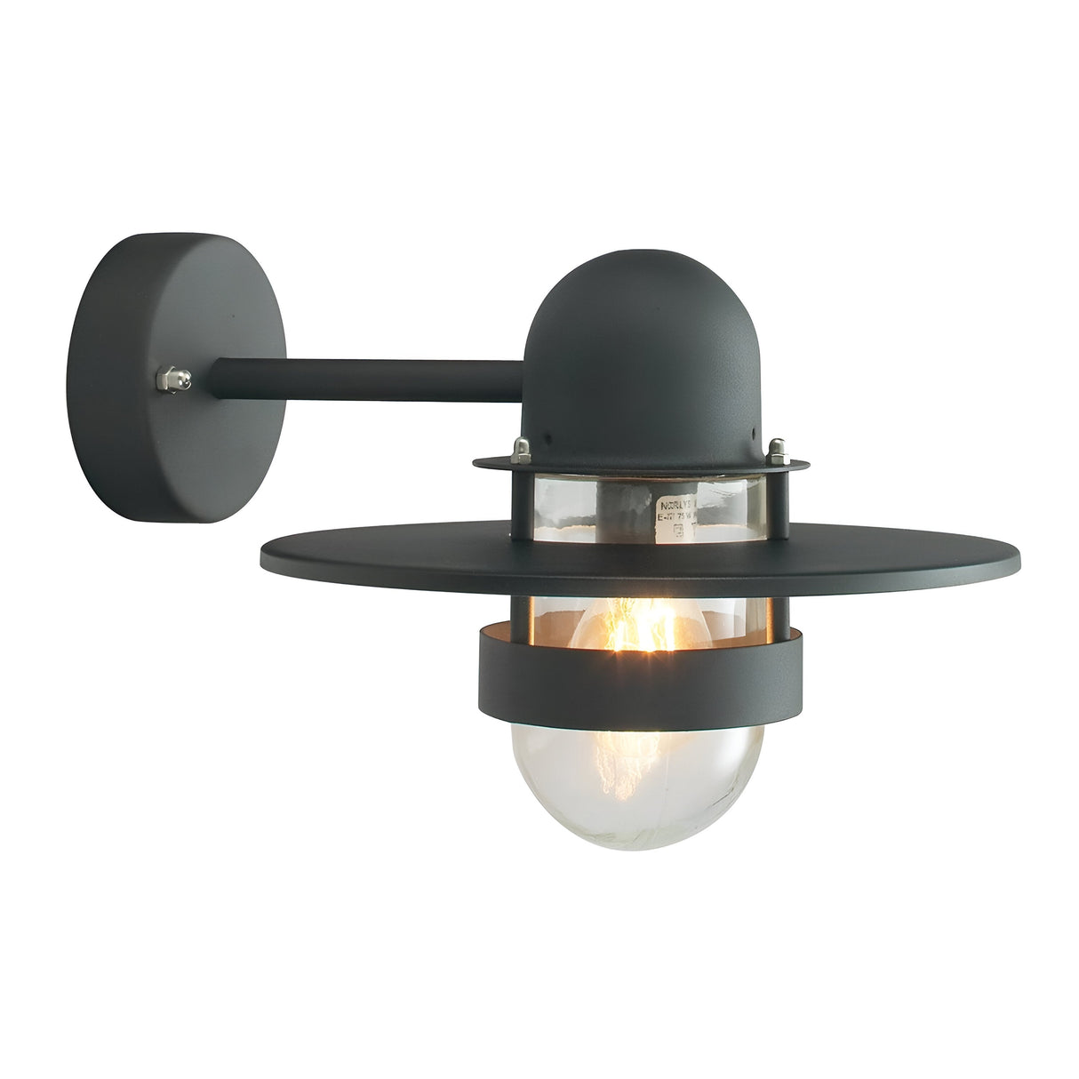 The Bergen Outdoor 1 Light Wall Lantern - Black is a stylish addition to outdoor spaces, featuring a sleek matte black finish. This modern wall-mounted fixture includes a round bulb enclosed in a clear dome, framed by two circular black disks, and is attached to the wall with a straight arm and circular mount.