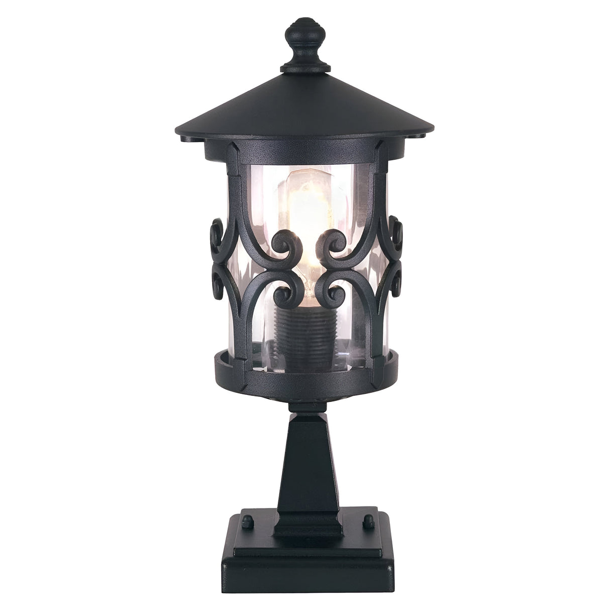 The Hereford 1 Light Pedestal Lantern - Black is a decorative outdoor fixture showcasing intricate iron scrollwork and a cylindrical clear glass casing. With its lantern-style design mounted on a square base, this lamp features a visible light bulb that beautifully enhances your outdoor lighting aesthetics.