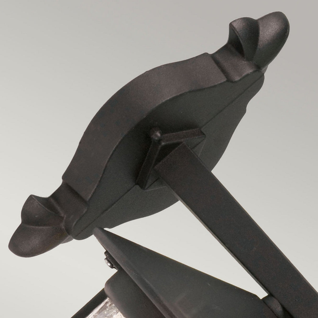 Close-up of the Hereford 1 Light Outdoor Large Wall Down Lantern in black against a plain grey background. The classic lantern style design showcases decorative curved elements at the ends.