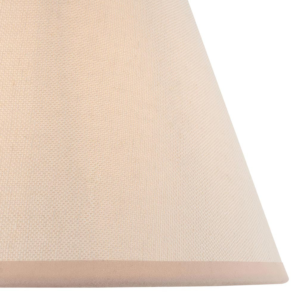 Close-up of the Brockbury 25cm tapered lamp shade in vintage white fabric with an almond taped edge, shown against a plain background.